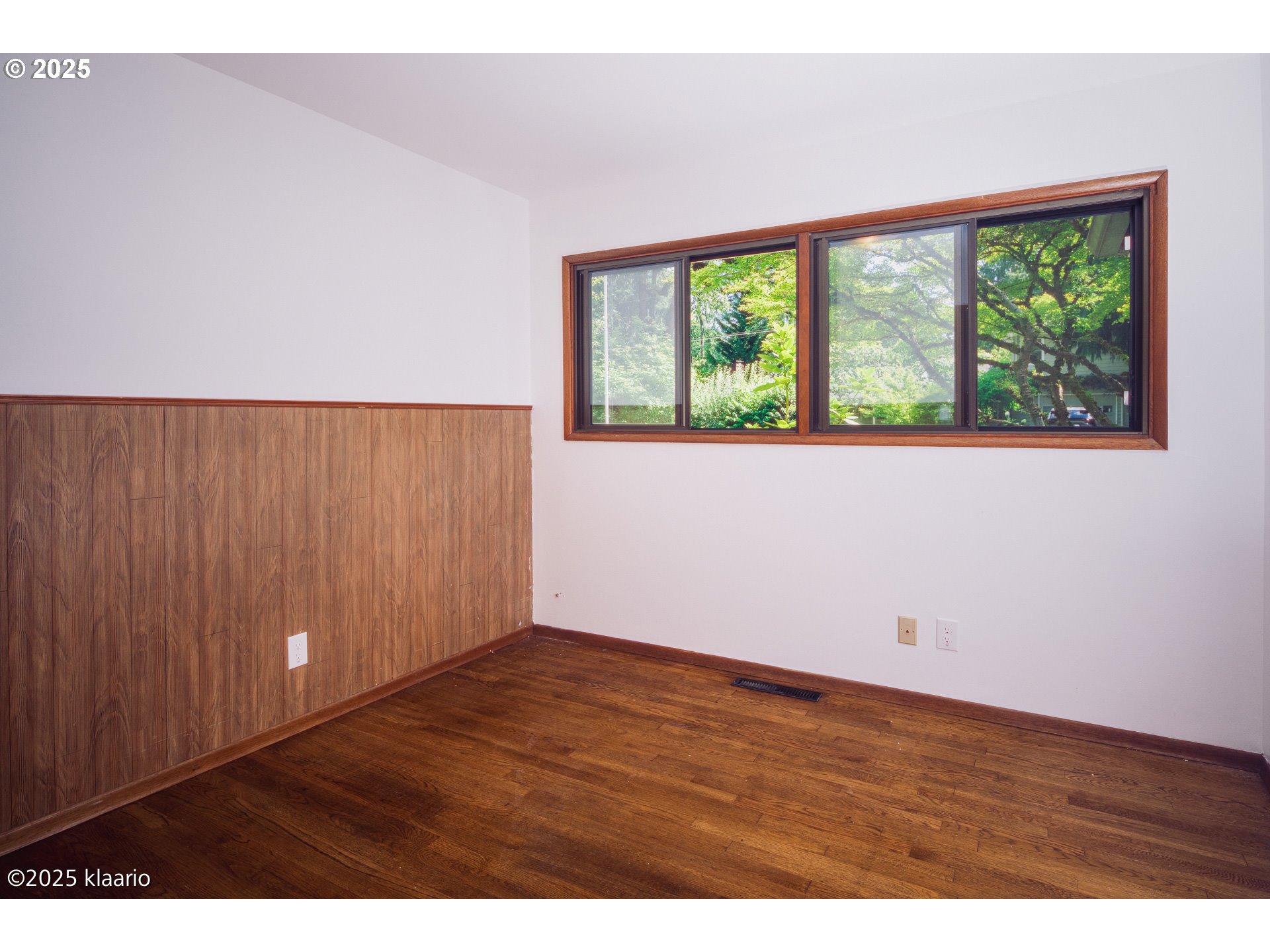 3691 Ridgewood Way West Linn, OR 97068 - Photo 13 of 34 an empty room with wooden floor and windows