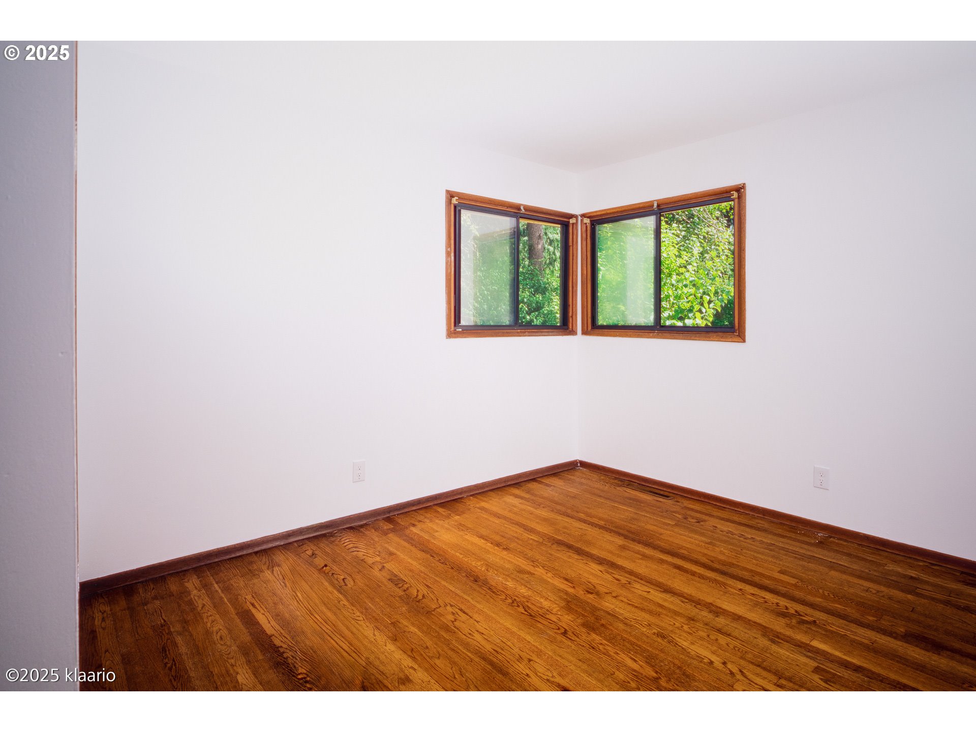 3691 Ridgewood Way West Linn, OR 97068 - Photo 21 of 34 a view of an empty room with wooden floor and a window
