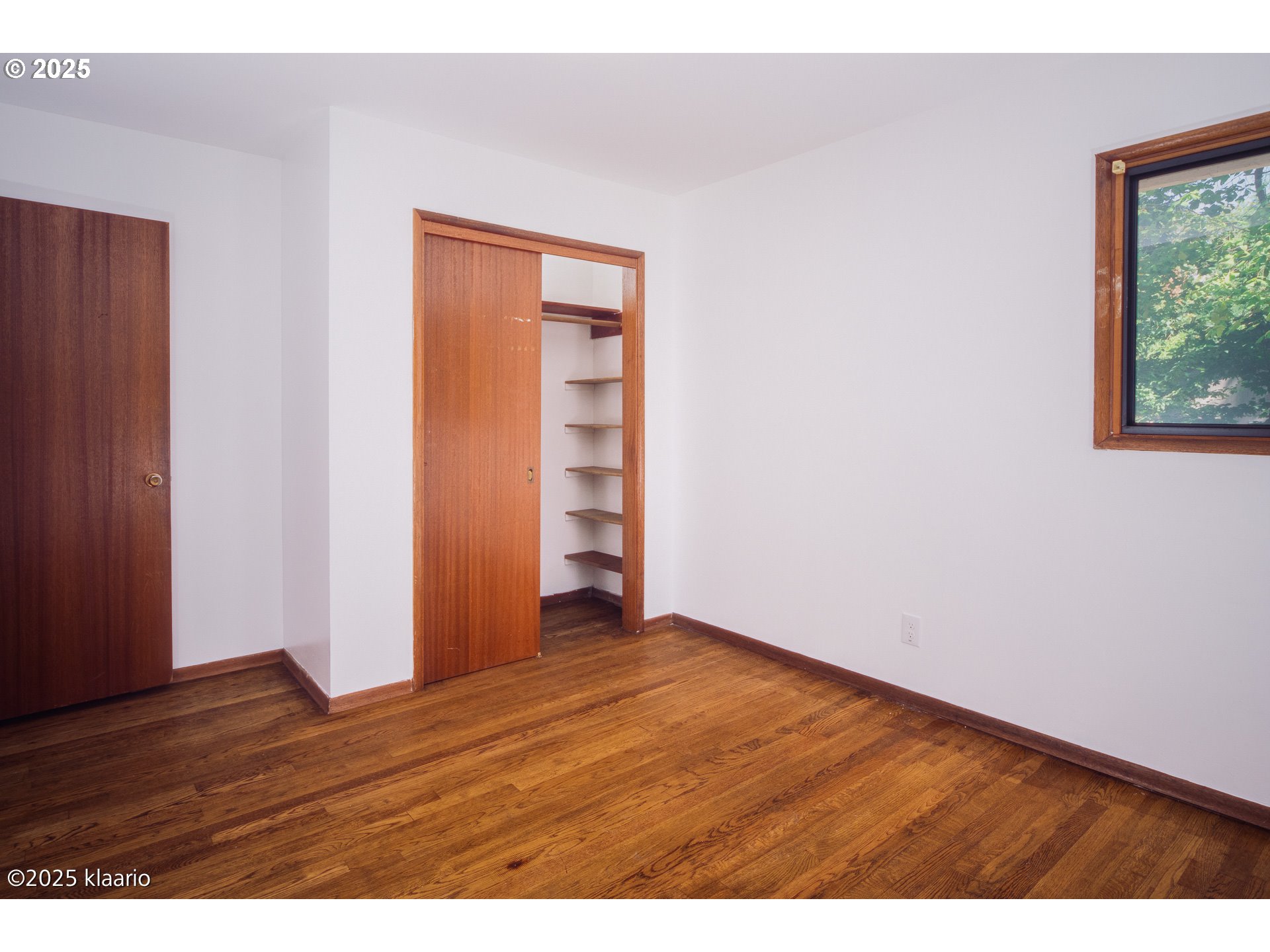 3691 Ridgewood Way West Linn, OR 97068 - Photo 24 of 34 a view of an empty room with wooden floor and a window