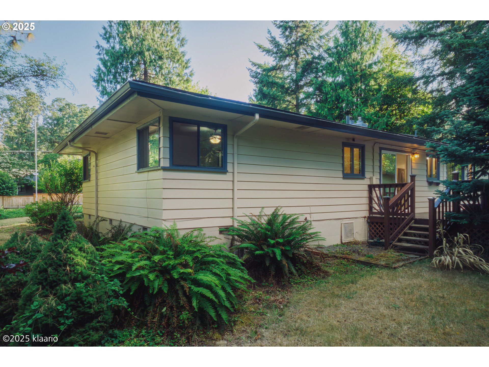 3691 Ridgewood Way West Linn, OR 97068 - Photo 26 of 34 a view of backyard of house with outdoor seating and green space