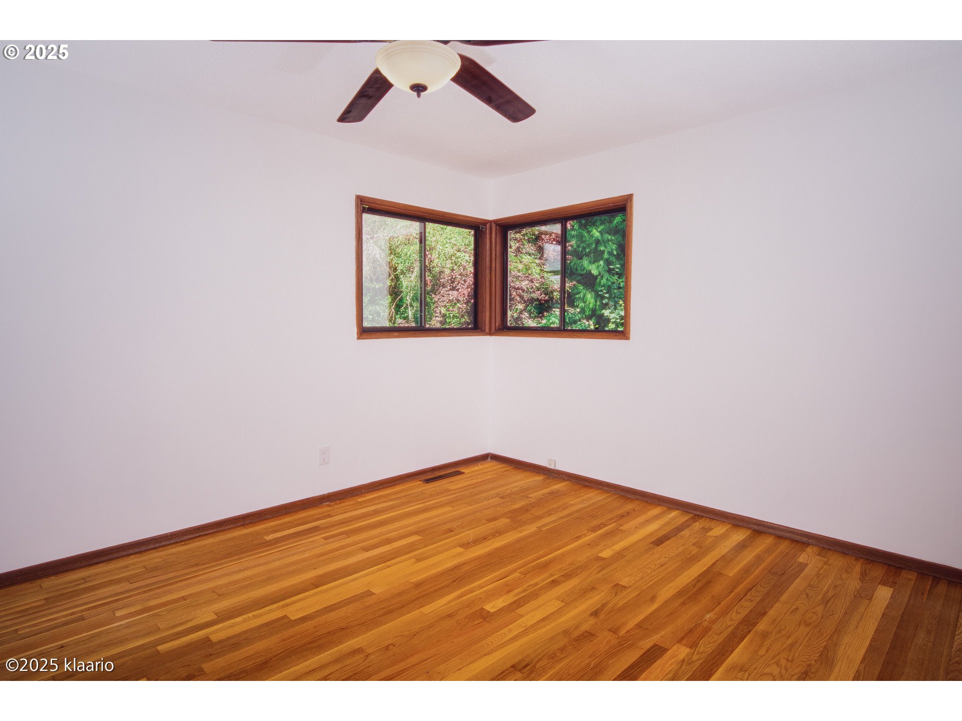 3691 Ridgewood Way West Linn, OR 97068 - Photo 28 of 34 a view of an empty room with wooden floor and a window