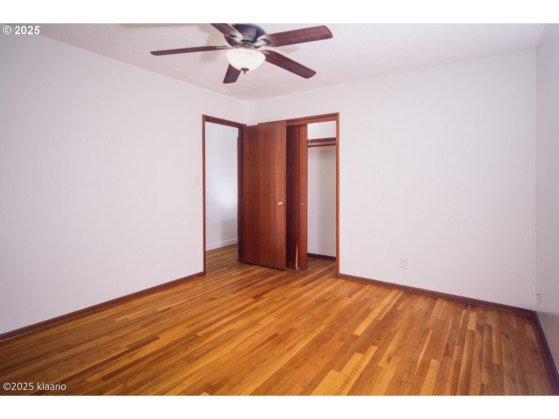 3691 Ridgewood Way West Linn, OR 97068 - Photo 32 of 34 a view of an empty room with wooden floor