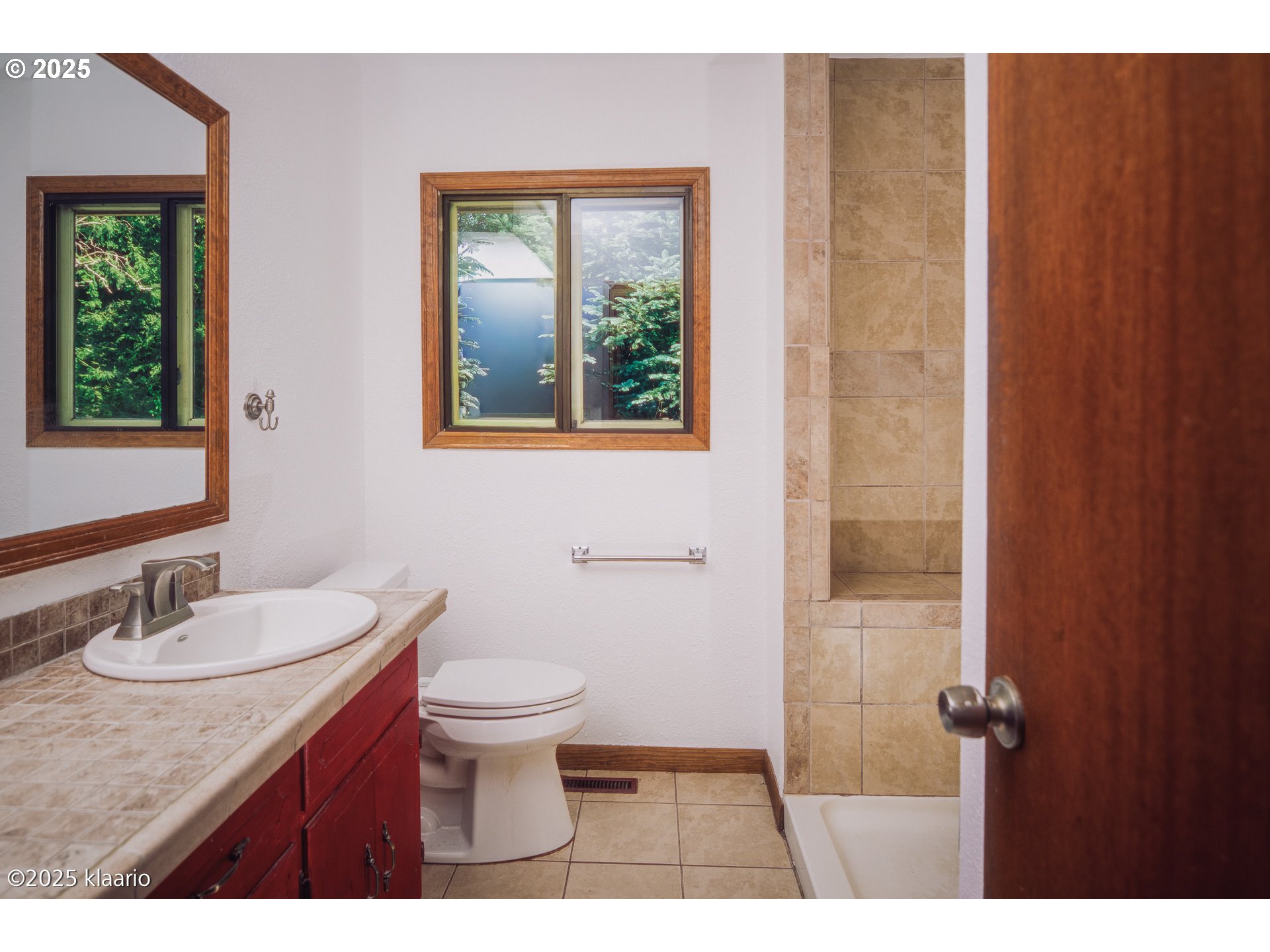3691 Ridgewood Way West Linn, OR 97068 - Photo 34 of 34 a bathroom with a granite countertop sink toilet a mirror and a window