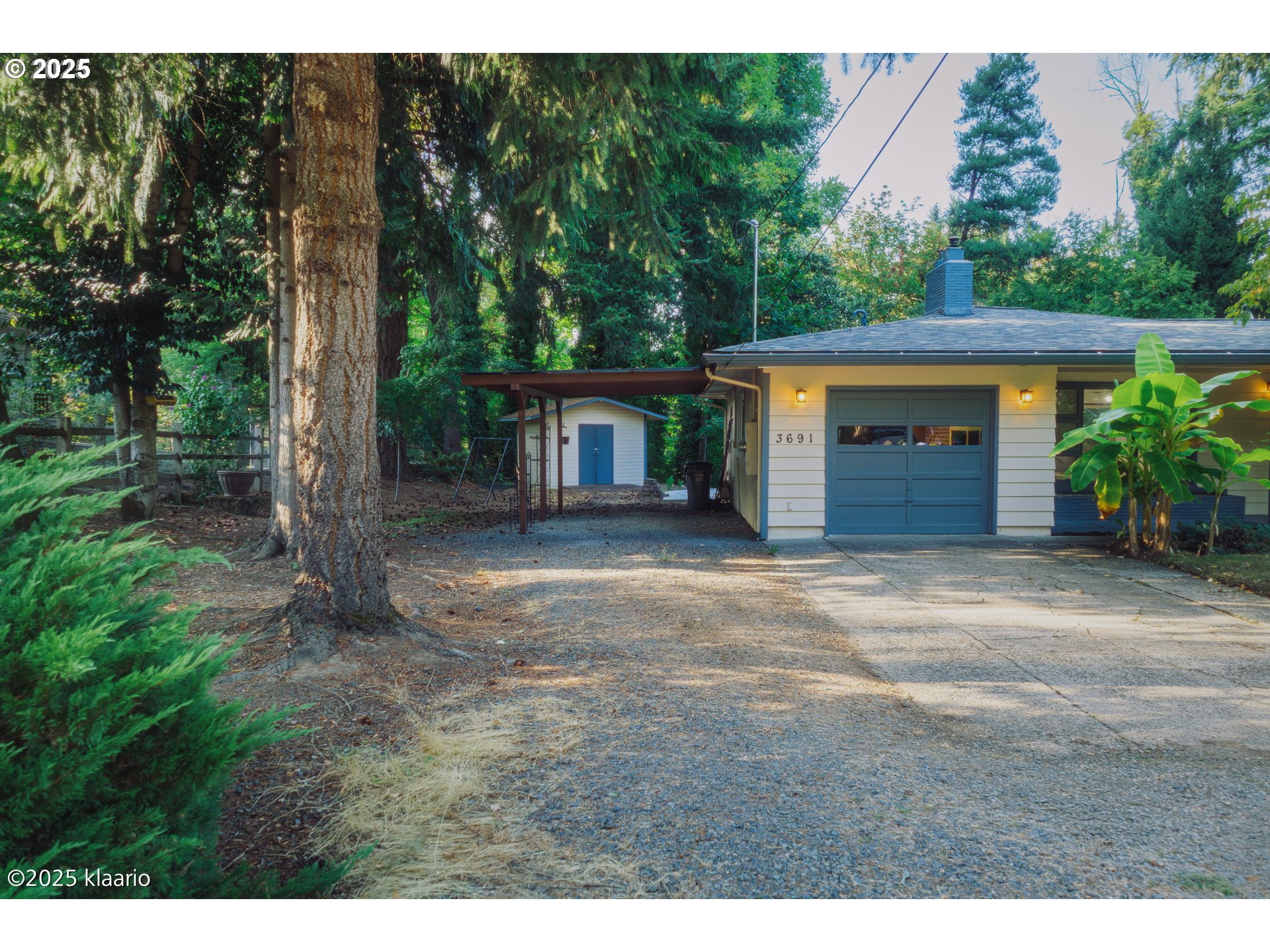3691 Ridgewood Way West Linn, OR 97068 - Photo 4 of 34 a front view of a house with a yard and garage