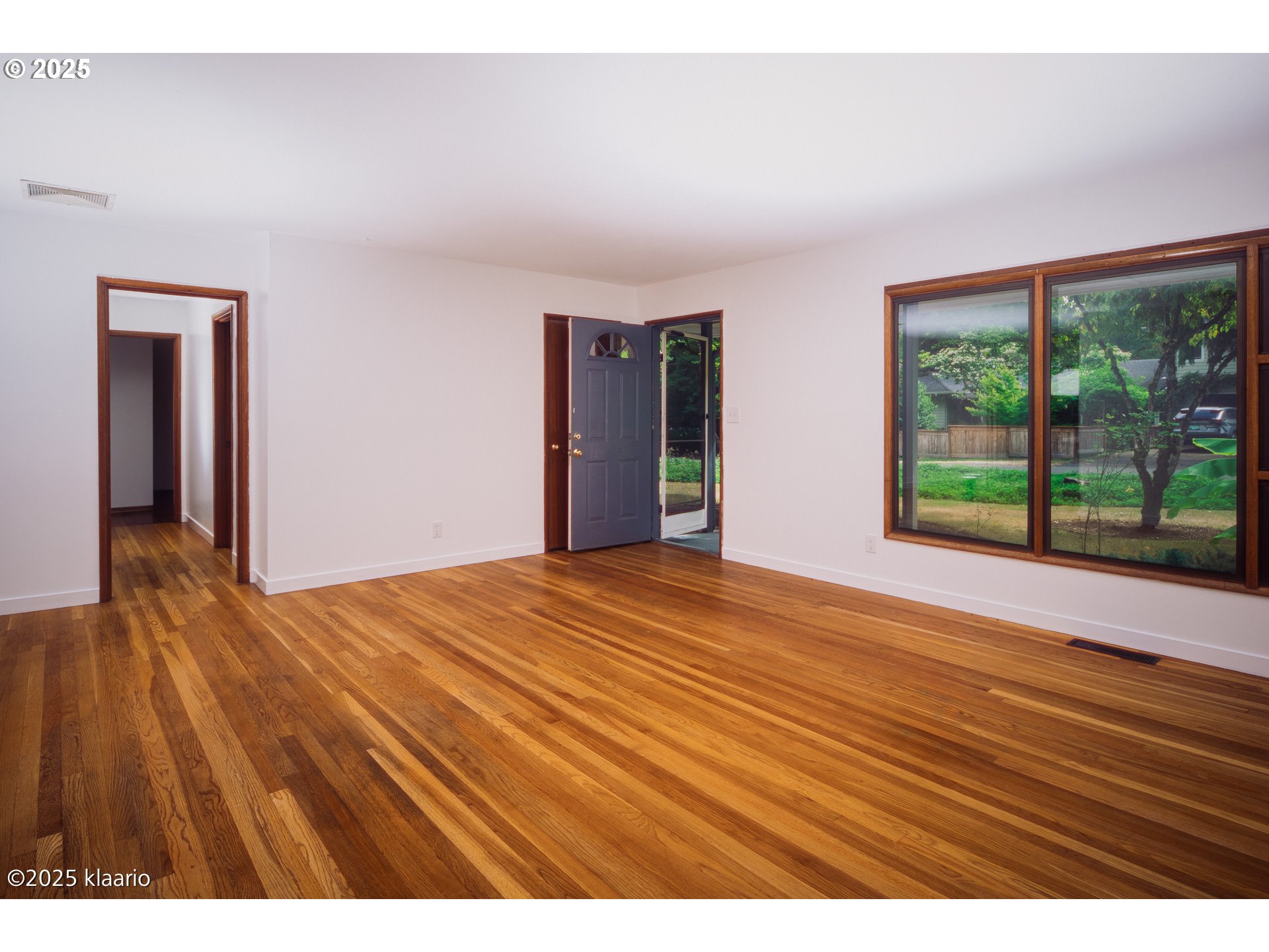 3691 Ridgewood Way West Linn, OR 97068 - Photo 6 of 34 a view of an empty room with wooden floor and a window