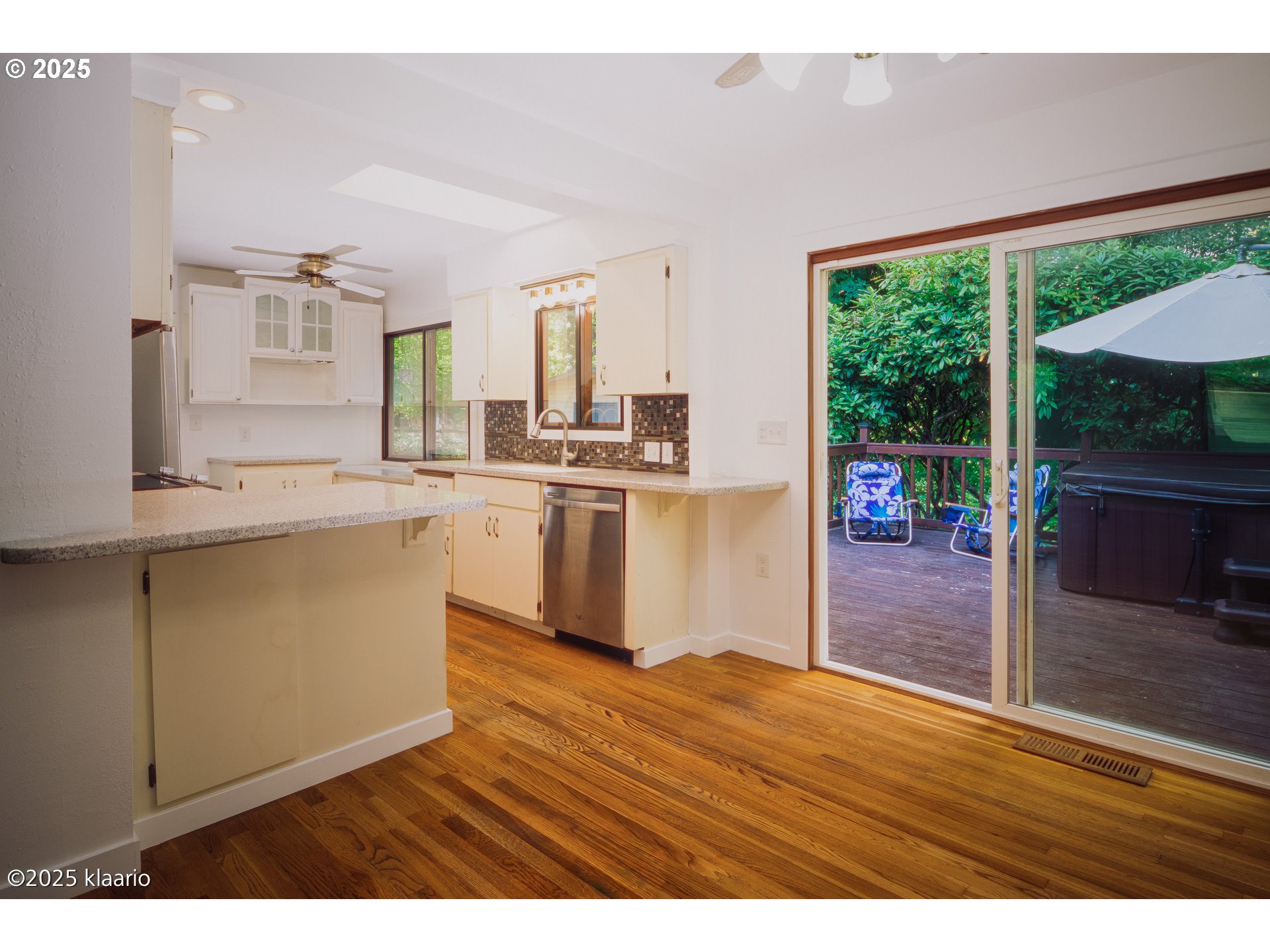 3691 Ridgewood Way West Linn, OR 97068 - Photo 8 of 34 a kitchen with stainless steel appliances granite countertop a sink and a stove