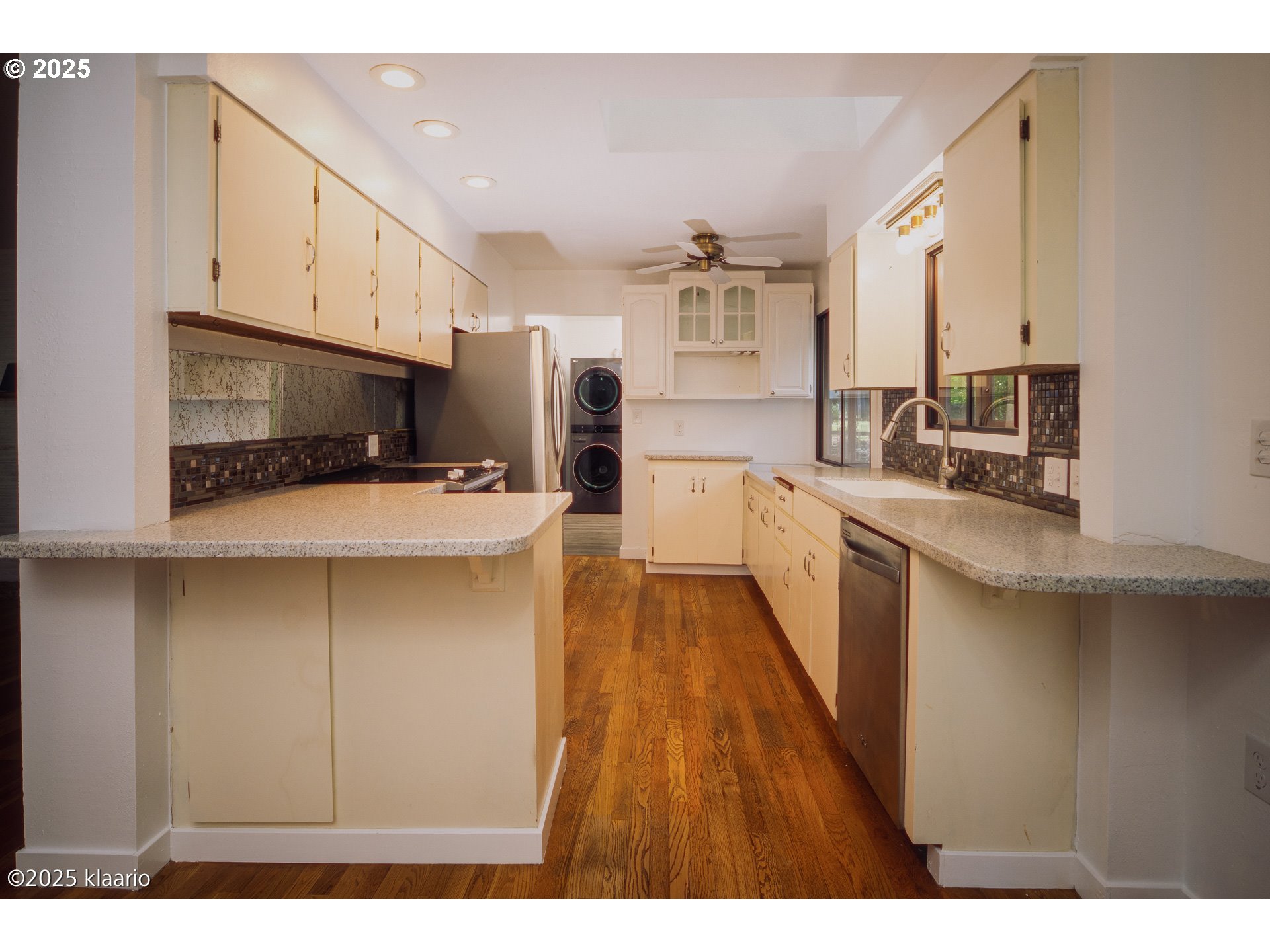 3691 Ridgewood Way West Linn, OR 97068 - Photo 9 of 34 a kitchen with stainless steel appliances a sink cabinets and wooden floor