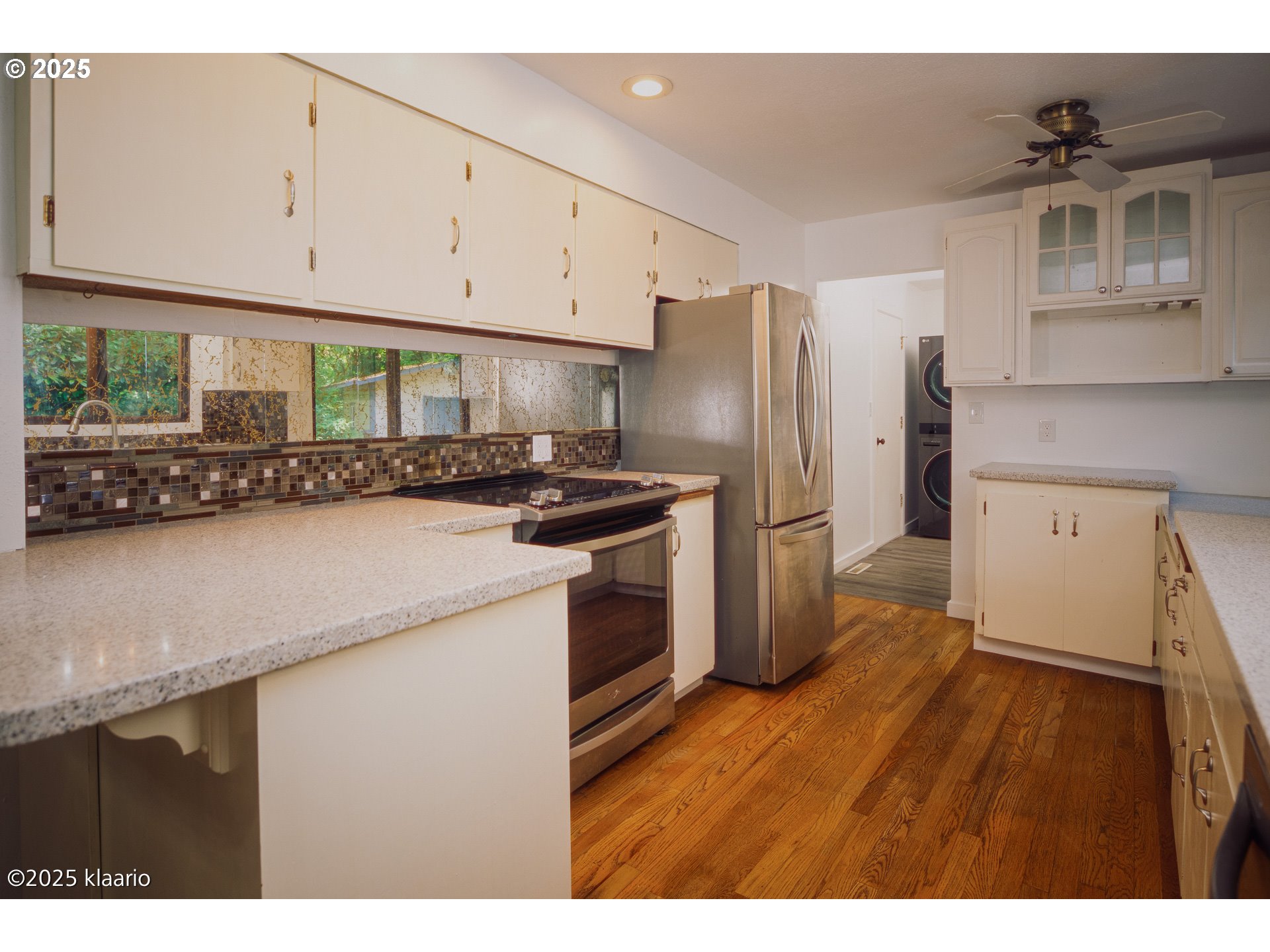 3691 Ridgewood Way West Linn, OR 97068 - Photo 10 of 34 a kitchen with a refrigerator sink and cabinets