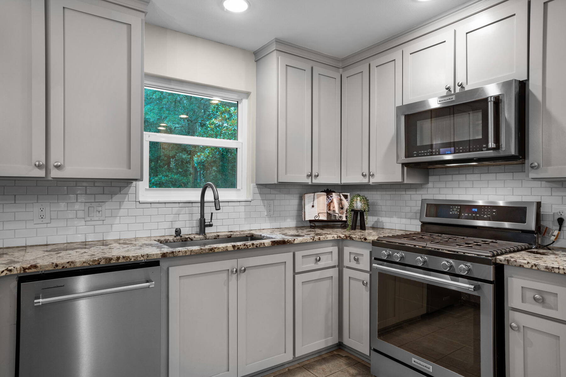 665 Brookhaven Way Niceville, FL 32578 - Photo 20 of 49 a kitchen with granite countertop a sink cabinets and stainless steel appliances