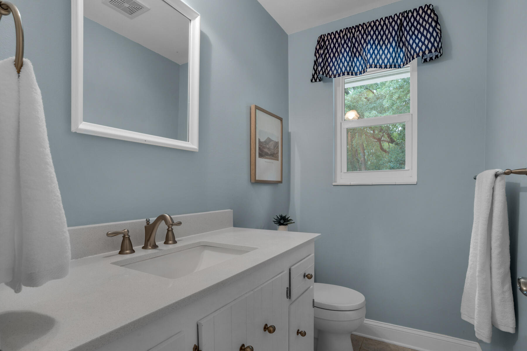 665 Brookhaven Way Niceville, FL 32578 - Photo 23 of 49 a bathroom with a sink toilet and window