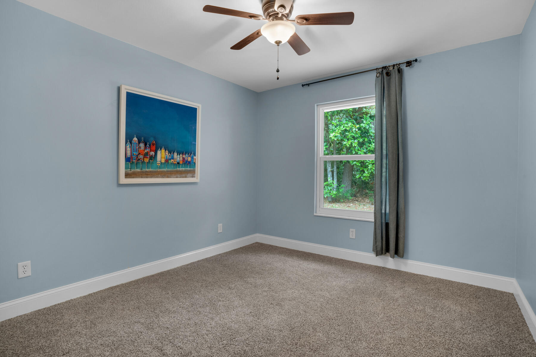 665 Brookhaven Way Niceville, FL 32578 - Photo 24 of 49 an empty room with a window and a fan