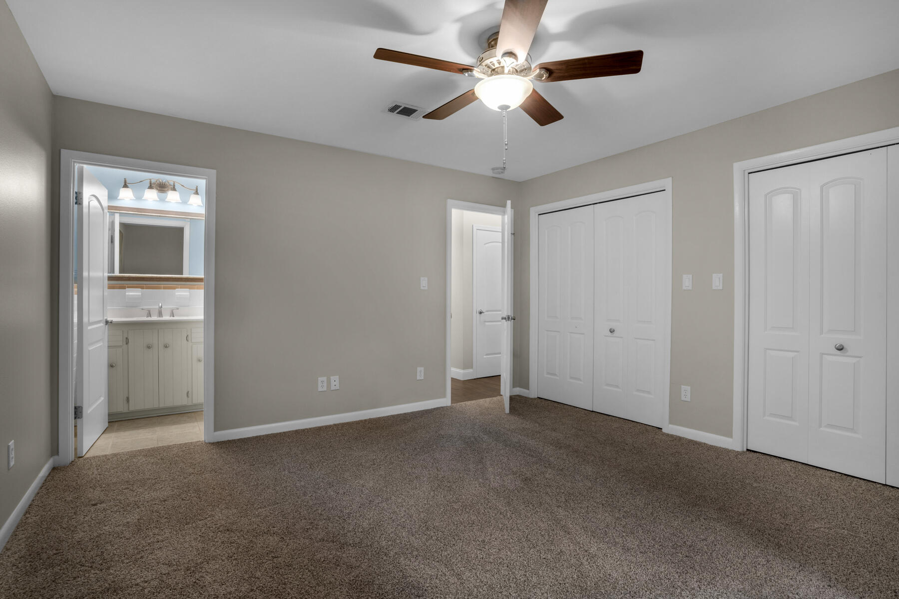 665 Brookhaven Way Niceville, FL 32578 - Photo 28 of 49 a view of an empty room with a ceiling fan