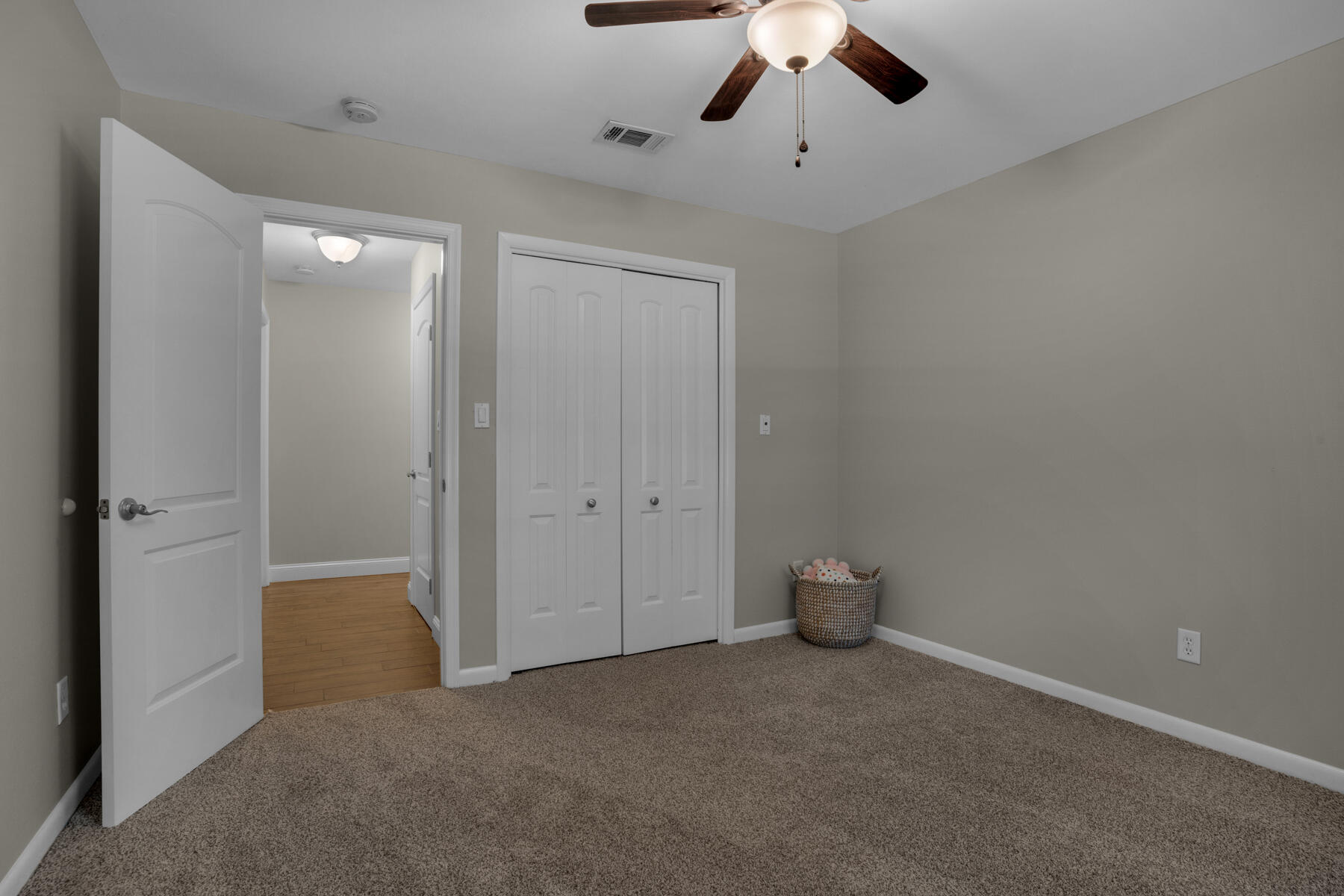 665 Brookhaven Way Niceville, FL 32578 - Photo 34 of 49 an empty room with a ceiling fan and carpet