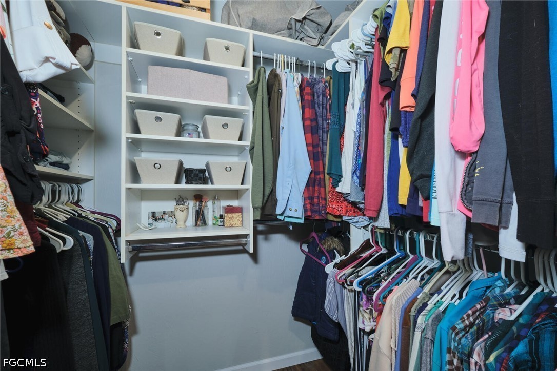 710-740 Evans Road LaBelle, FL 33935 - Photo 14 of 50 a view of walk in closet with clothes and shoes
