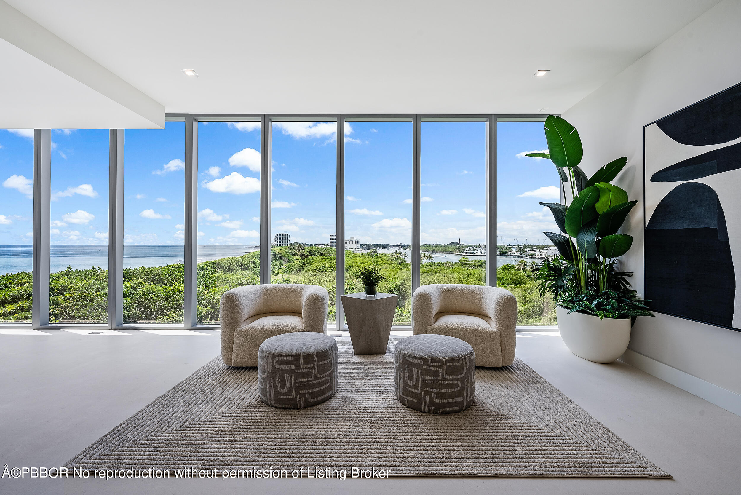 1500 South Beach Road, Unit 403 Jupiter, FL 33469 - Photo 12 of 36 a living room with furniture potted plant and a large window