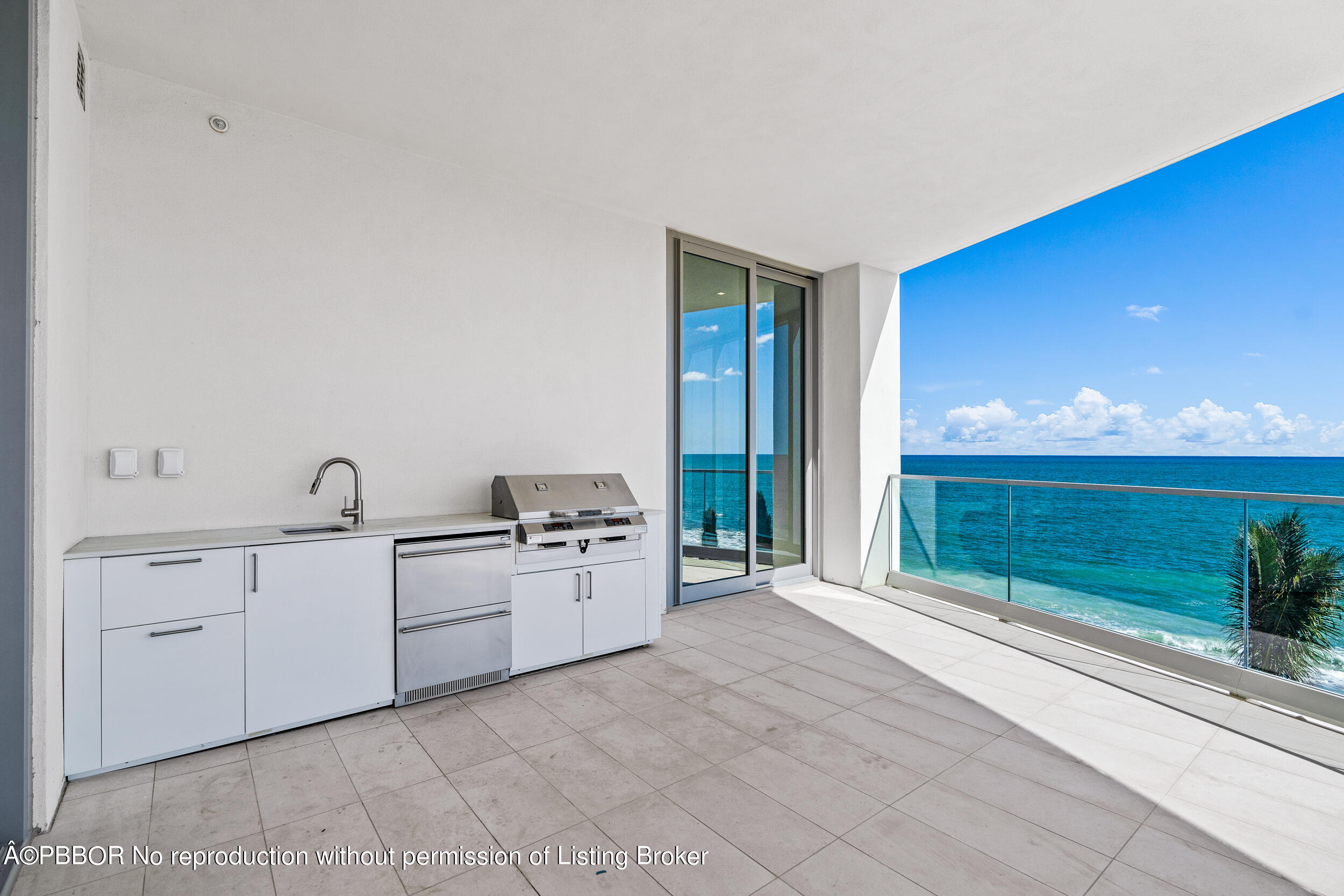 1500 South Beach Road, Unit 403 Jupiter, FL 33469 - Photo 17 of 36 a large white kitchen with a sink and large window