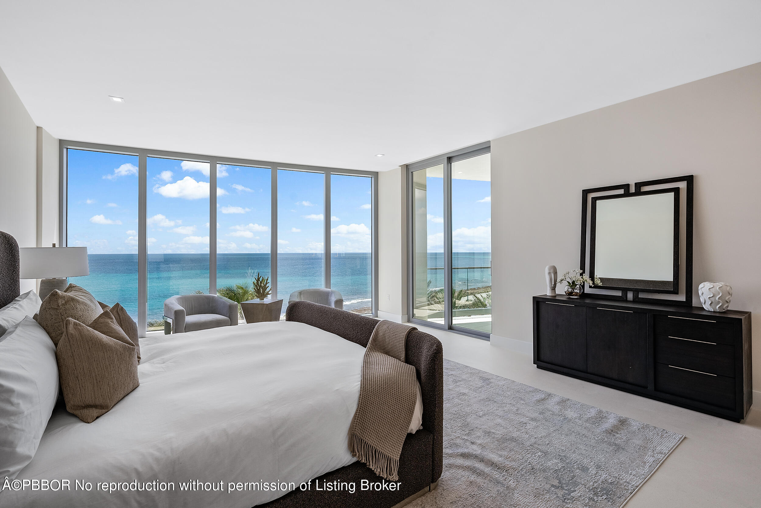 1500 South Beach Road, Unit 403 Jupiter, FL 33469 - Photo 21 of 36 a large bedroom with a large bed and a large window