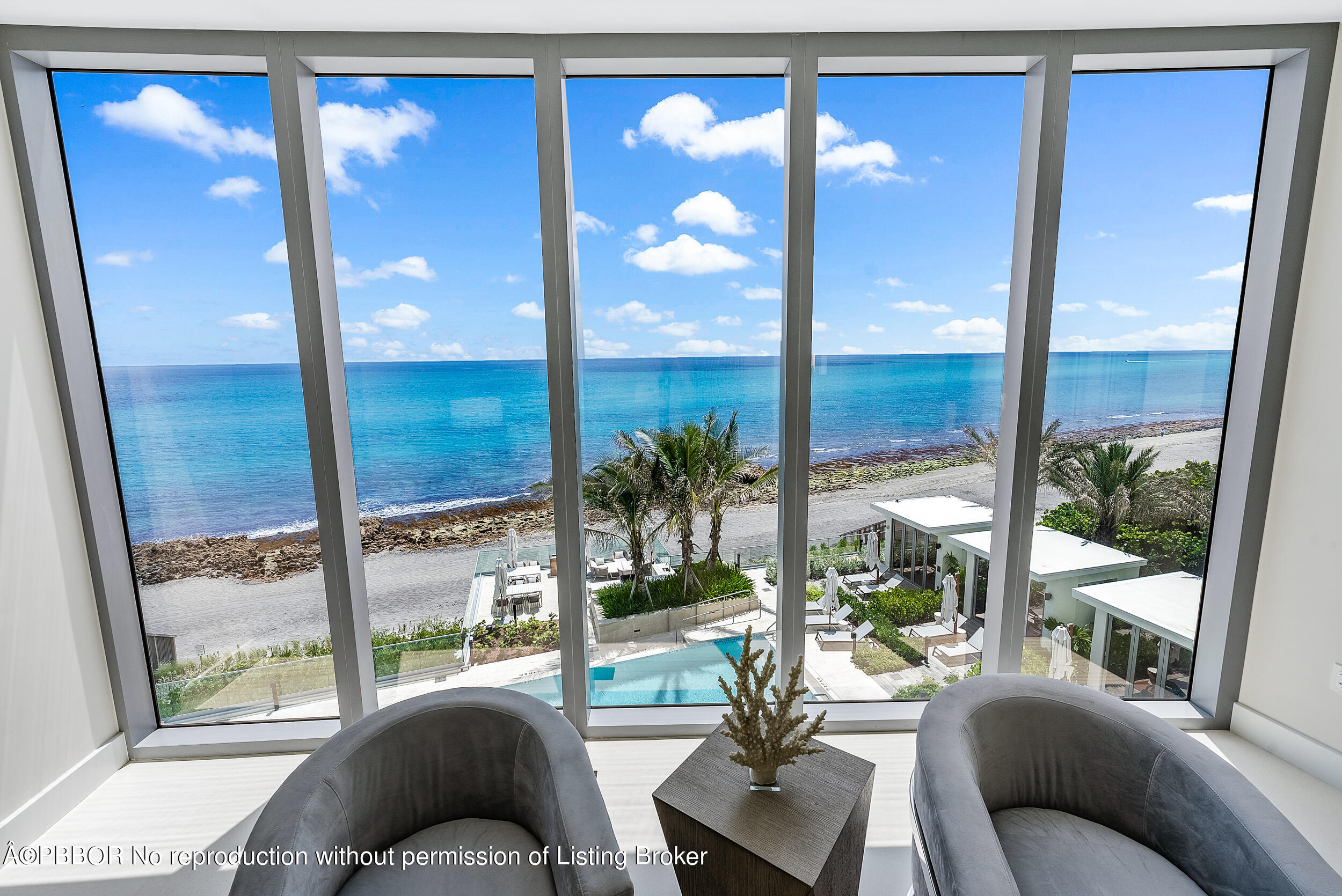 1500 South Beach Road, Unit 403 Jupiter, FL 33469 - Photo 22 of 36 a living room filled with furniture and a floor to ceiling window