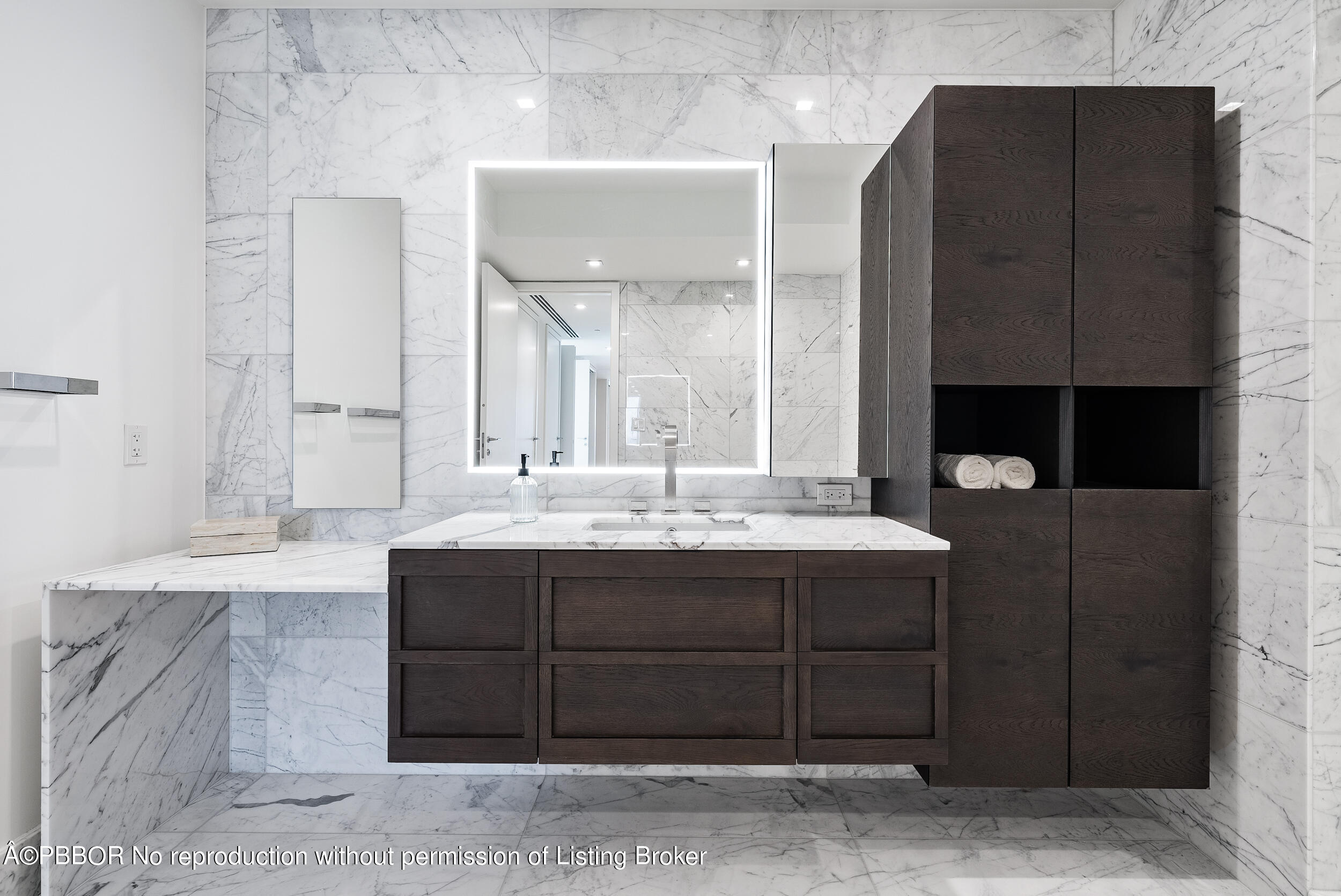 1500 South Beach Road, Unit 403 Jupiter, FL 33469 - Photo 24 of 36 a bathroom with a sink and a mirror