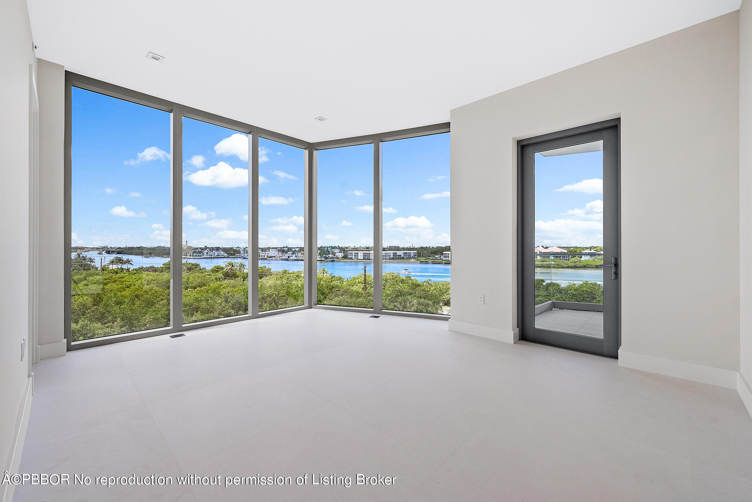 1500 South Beach Road, Unit 403 Jupiter, FL 33469 - Photo 31 of 36 a view of an empty room with wooden floor and windows
