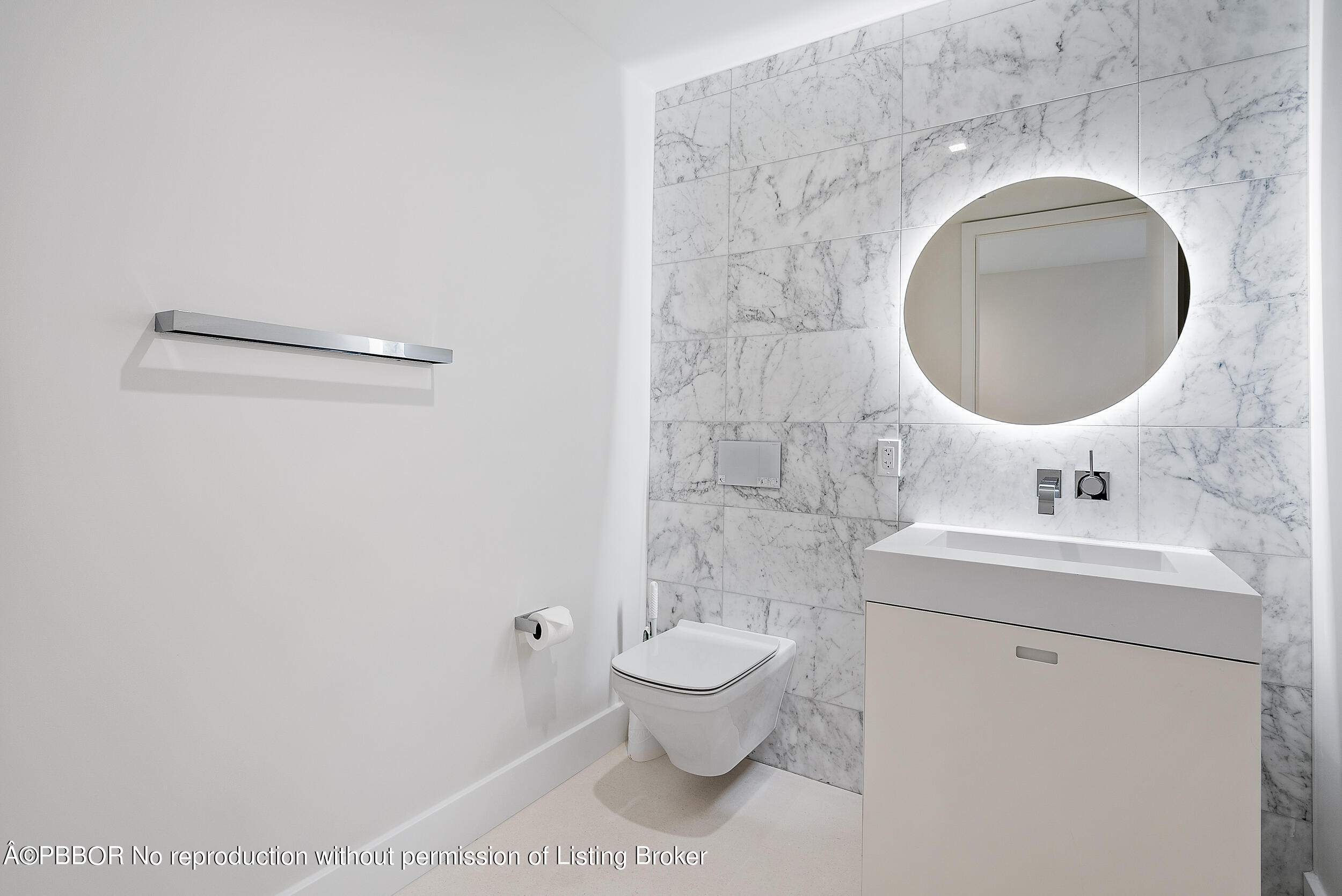 1500 South Beach Road, Unit 403 Jupiter, FL 33469 - Photo 33 of 36 a bathroom with a toilet sink and mirror