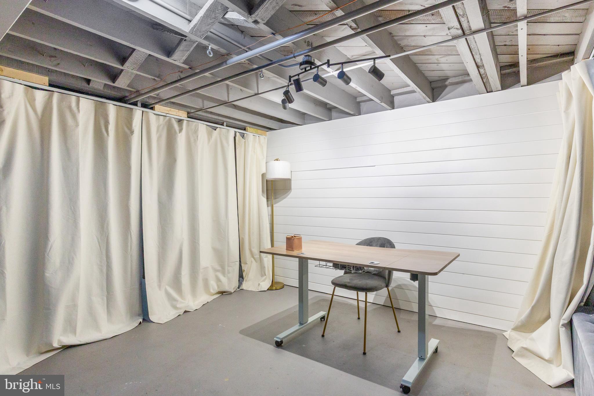 413 Imla Street Baltimore, MD 21224 - Photo 31 of 38 a view of a room with table and chairs