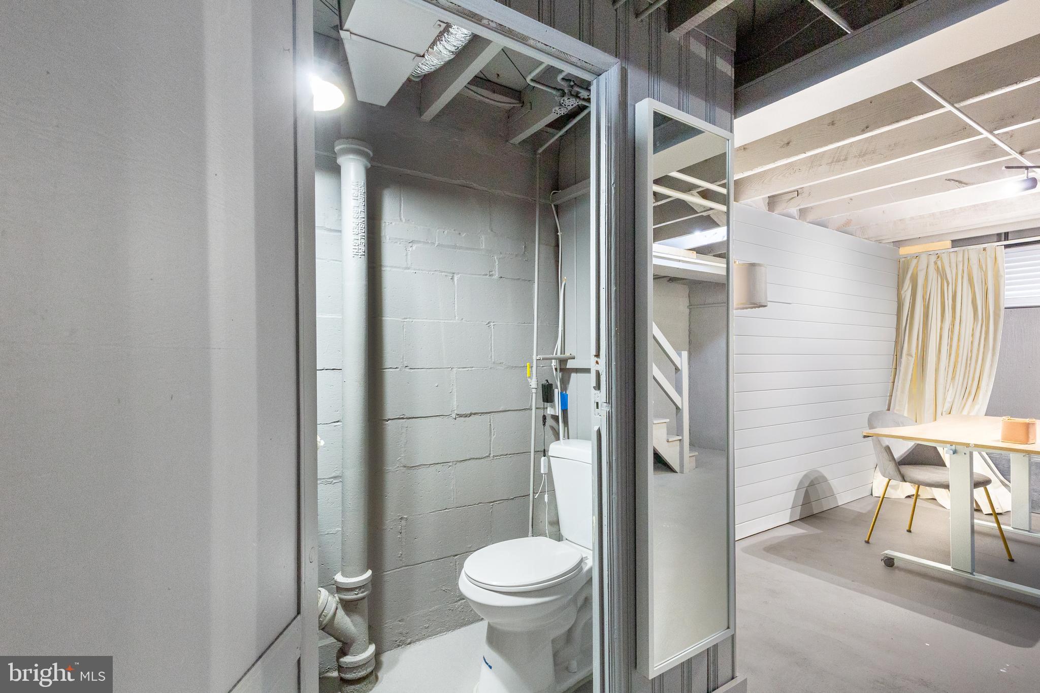 413 Imla Street Baltimore, MD 21224 - Photo 36 of 38 a bathroom with a toilet and a sink