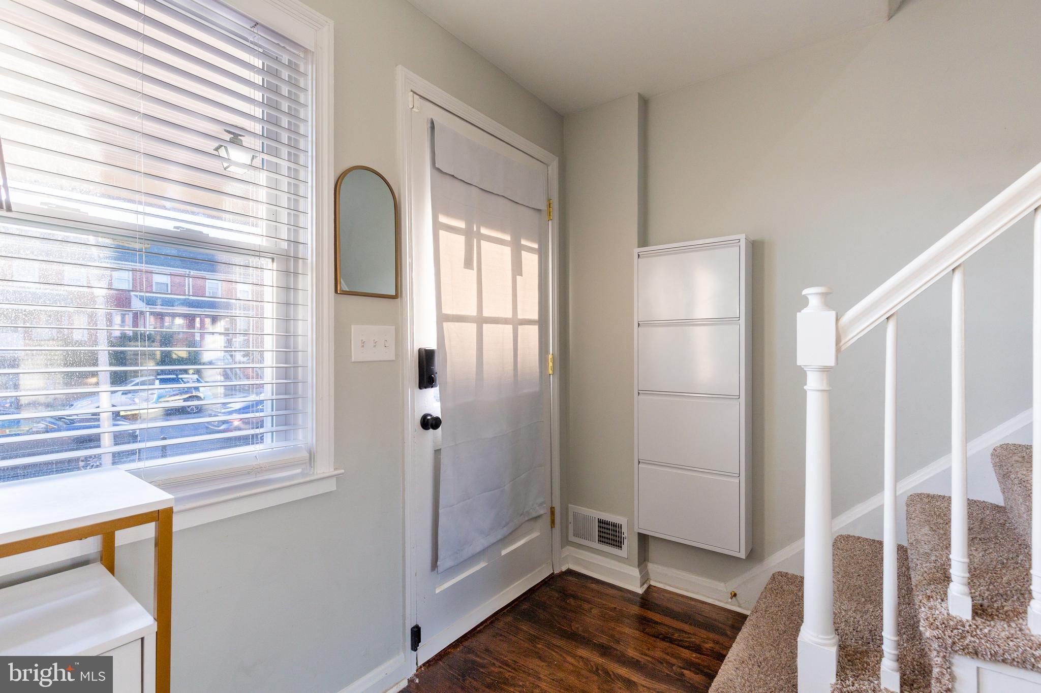 413 Imla Street Baltimore, MD 21224 - Photo 6 of 38 a view of front door with wooden floor