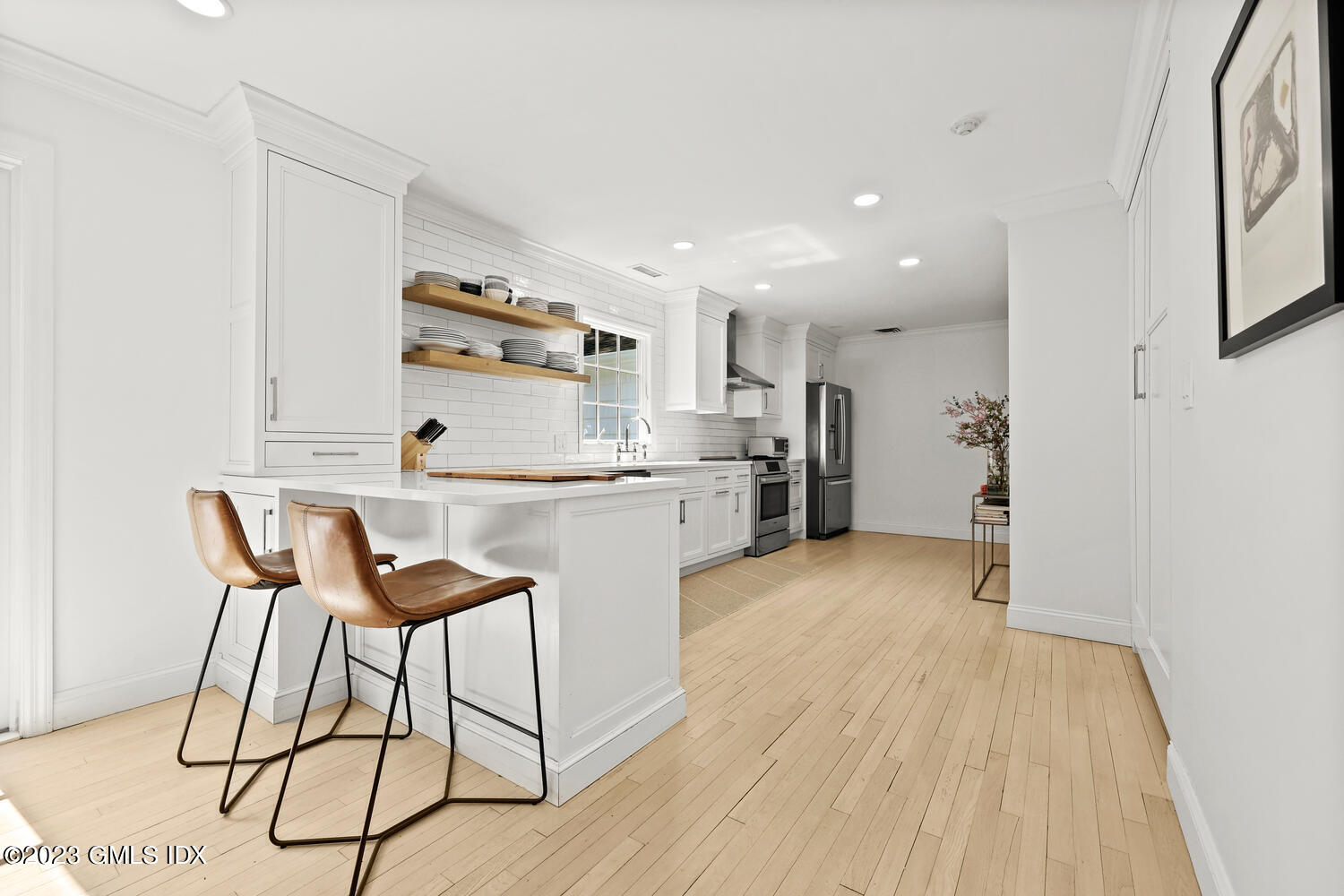 7 Cottontail Road Cos Cob, CT 06807 - Photo 13 of 39 a kitchen with stainless steel appliances kitchen island hardwood floor and a sink