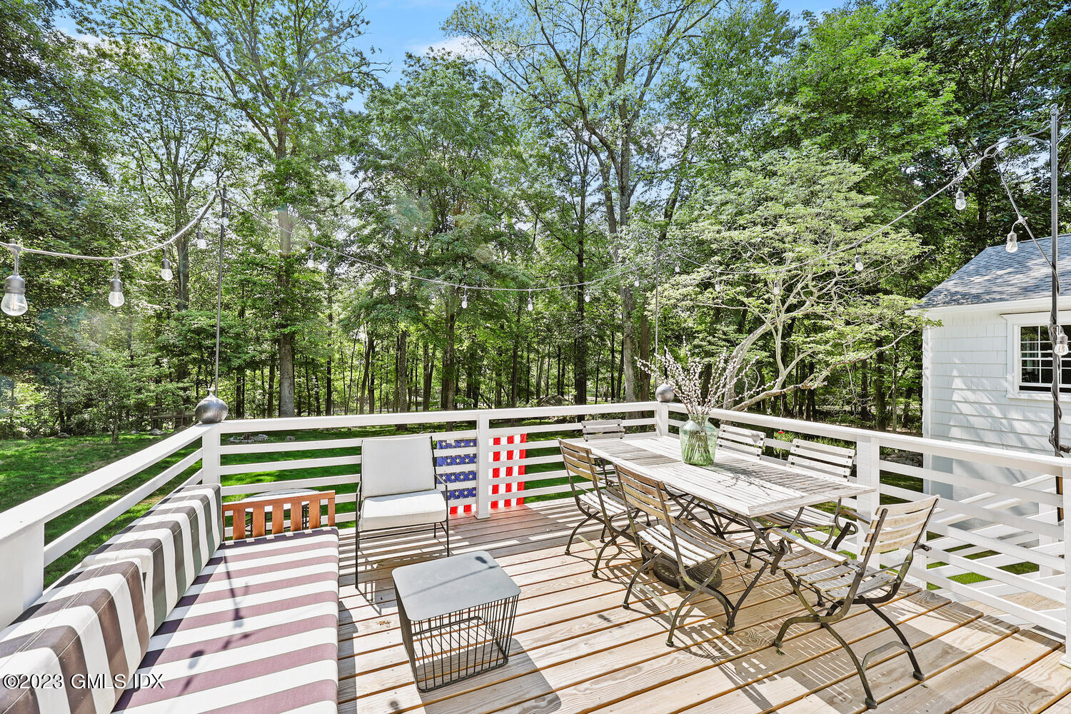7 Cottontail Road Cos Cob, CT 06807 - Photo 18 of 39 a view of a patio with couches table and chairs and wooden floor