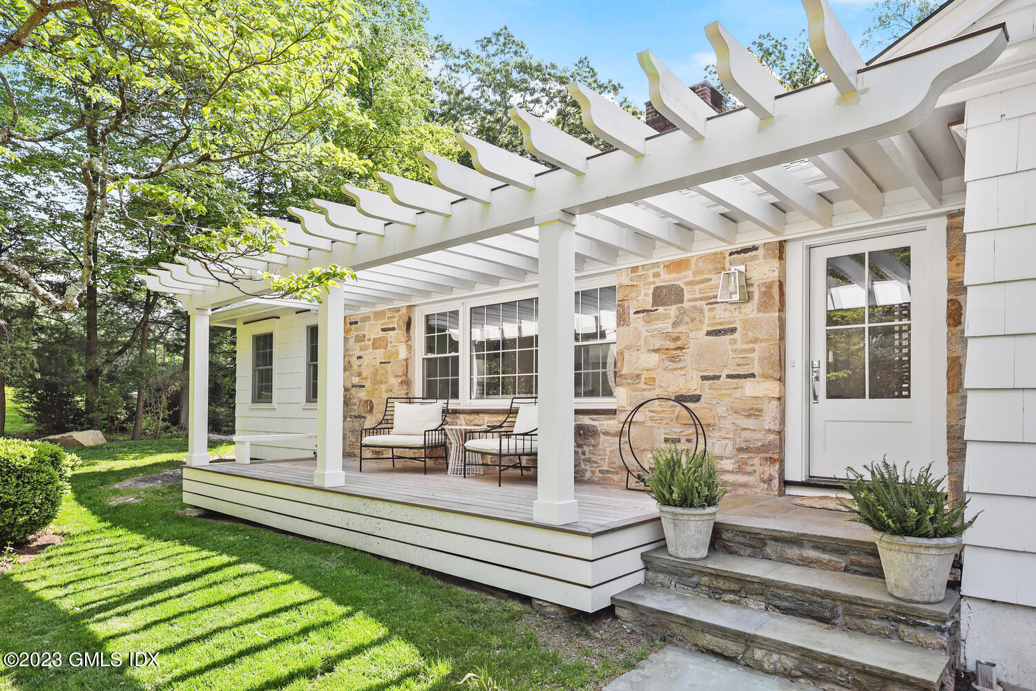 7 Cottontail Road Cos Cob, CT 06807 - Photo 2 of 39 a front view of a house with garden and patio