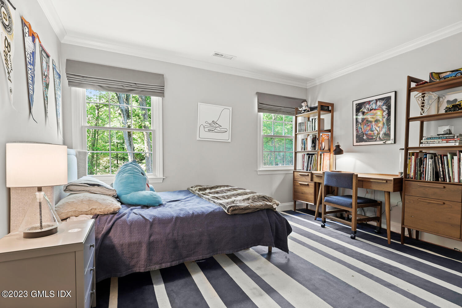 7 Cottontail Road Cos Cob, CT 06807 - Photo 26 of 39 a bedroom with a bed and a book shelf