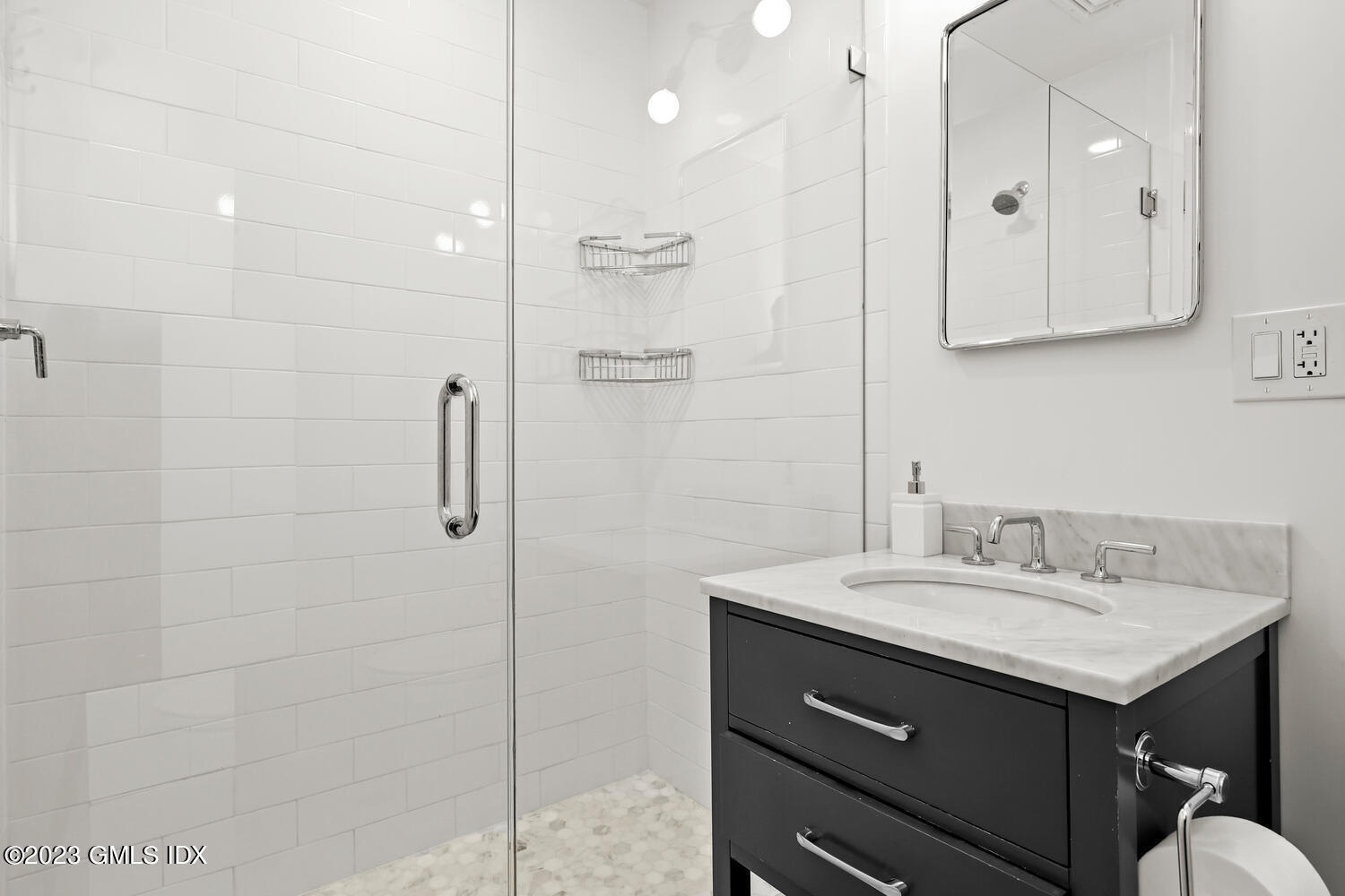 7 Cottontail Road Cos Cob, CT 06807 - Photo 27 of 39 a bathroom with a sink double vanity and a shower