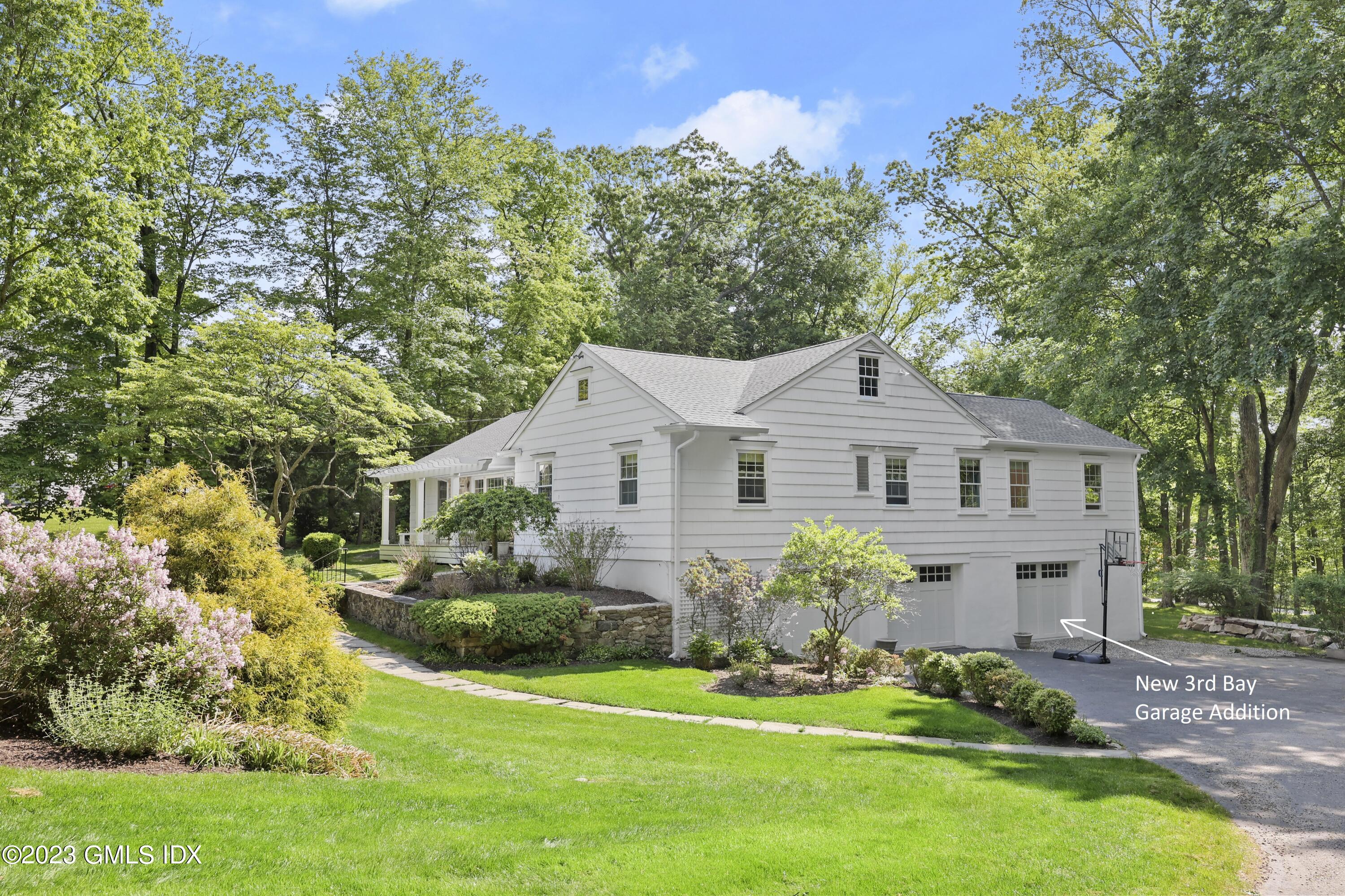 7 Cottontail Road Cos Cob, CT 06807 - Photo 36 of 39 a front view of a house with a garden