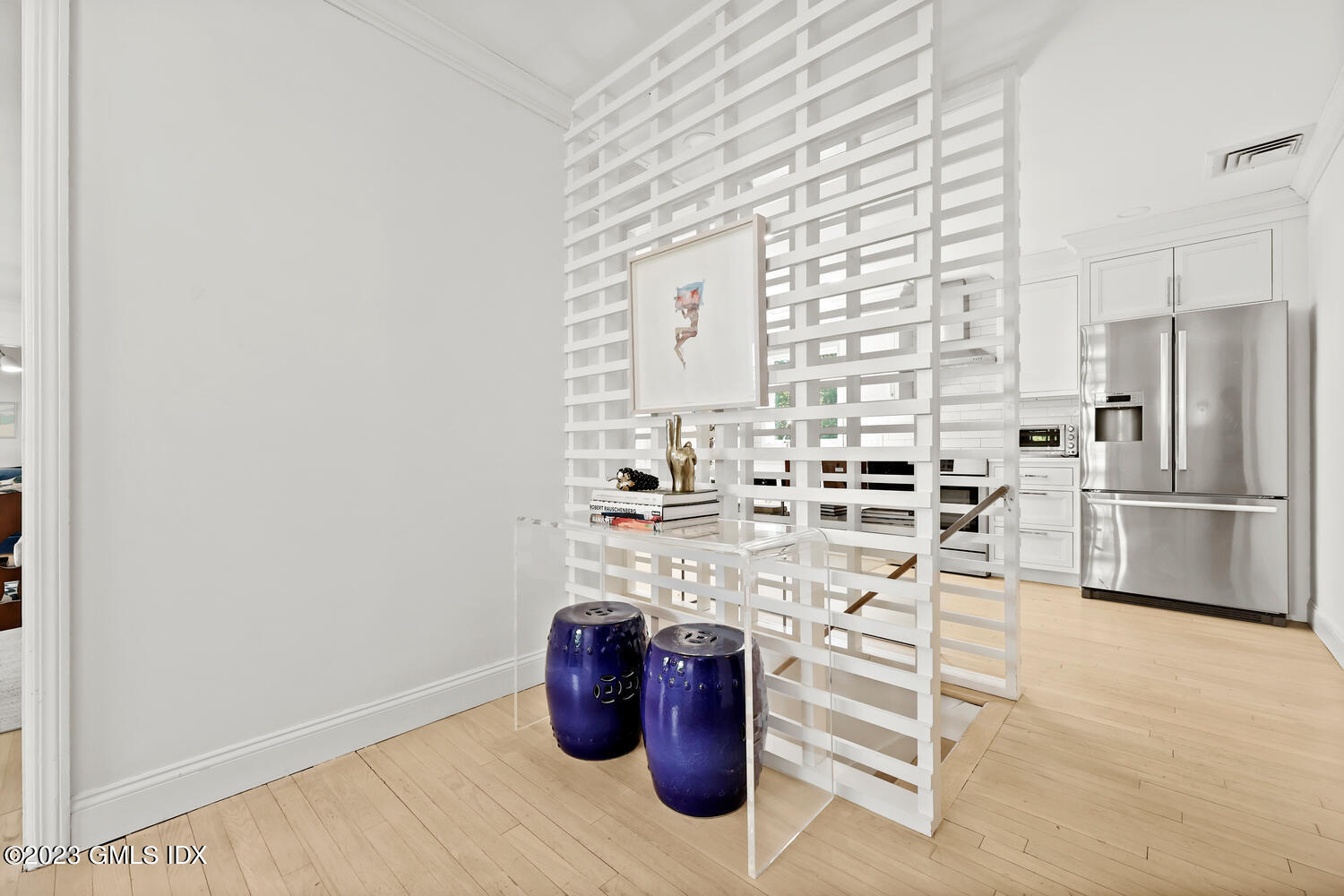 7 Cottontail Road Cos Cob, CT 06807 - Photo 9 of 39 a kitchen with stainless steel appliances a refrigerator and white cabinets