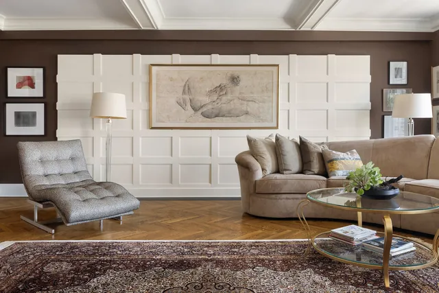 a living room with furniture and a rug