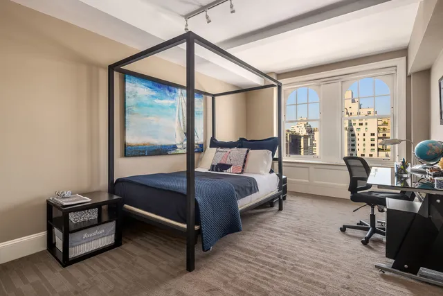 a workspace with furniture and book shelf