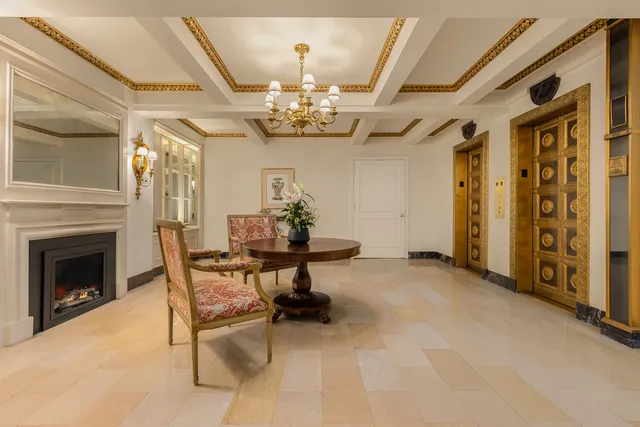 a view of hall way with furniture