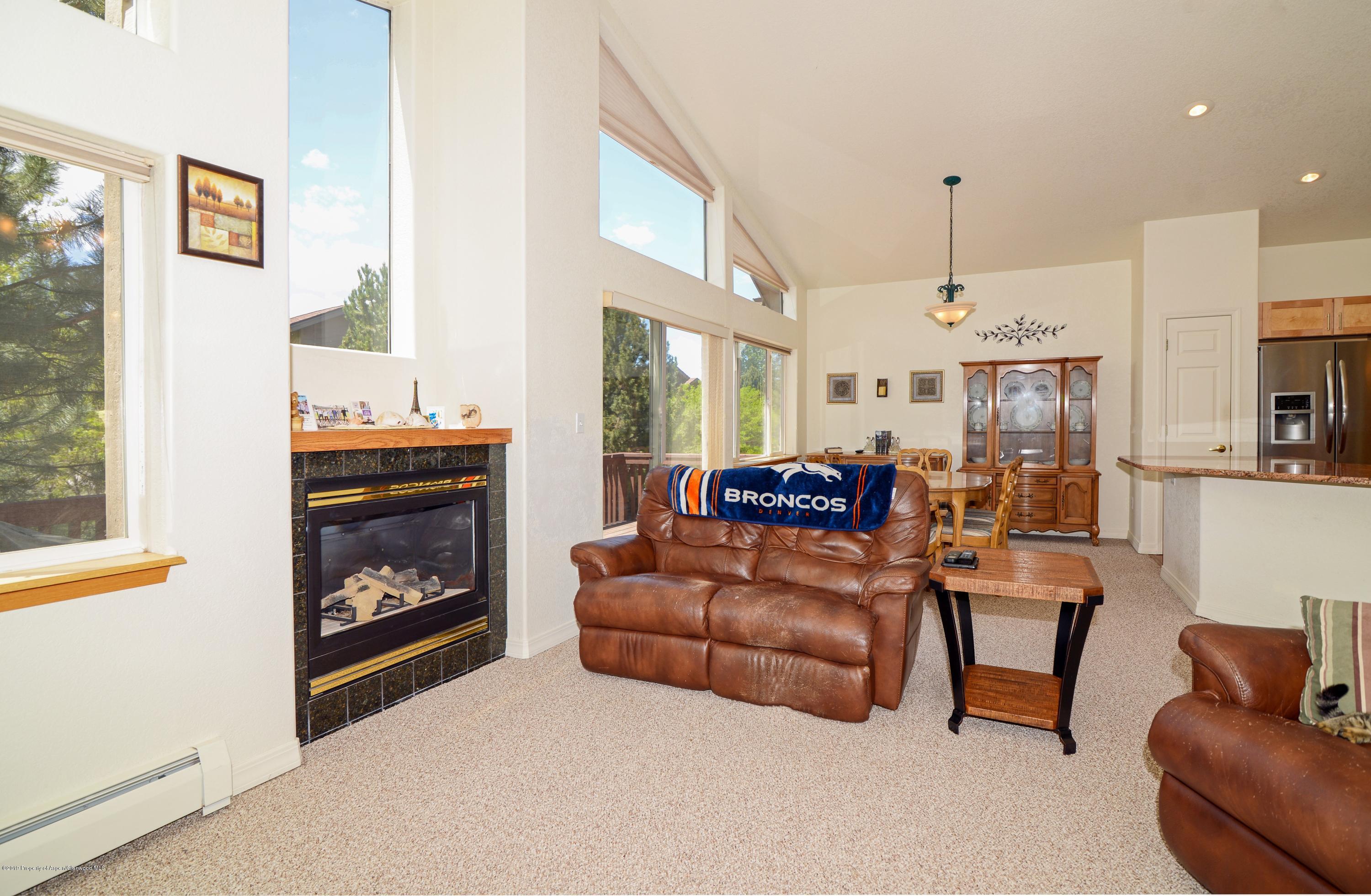 15 Pine Ridge Road Basalt, CO 81621 - Photo 3 of 17 a living room with furniture and a fireplace