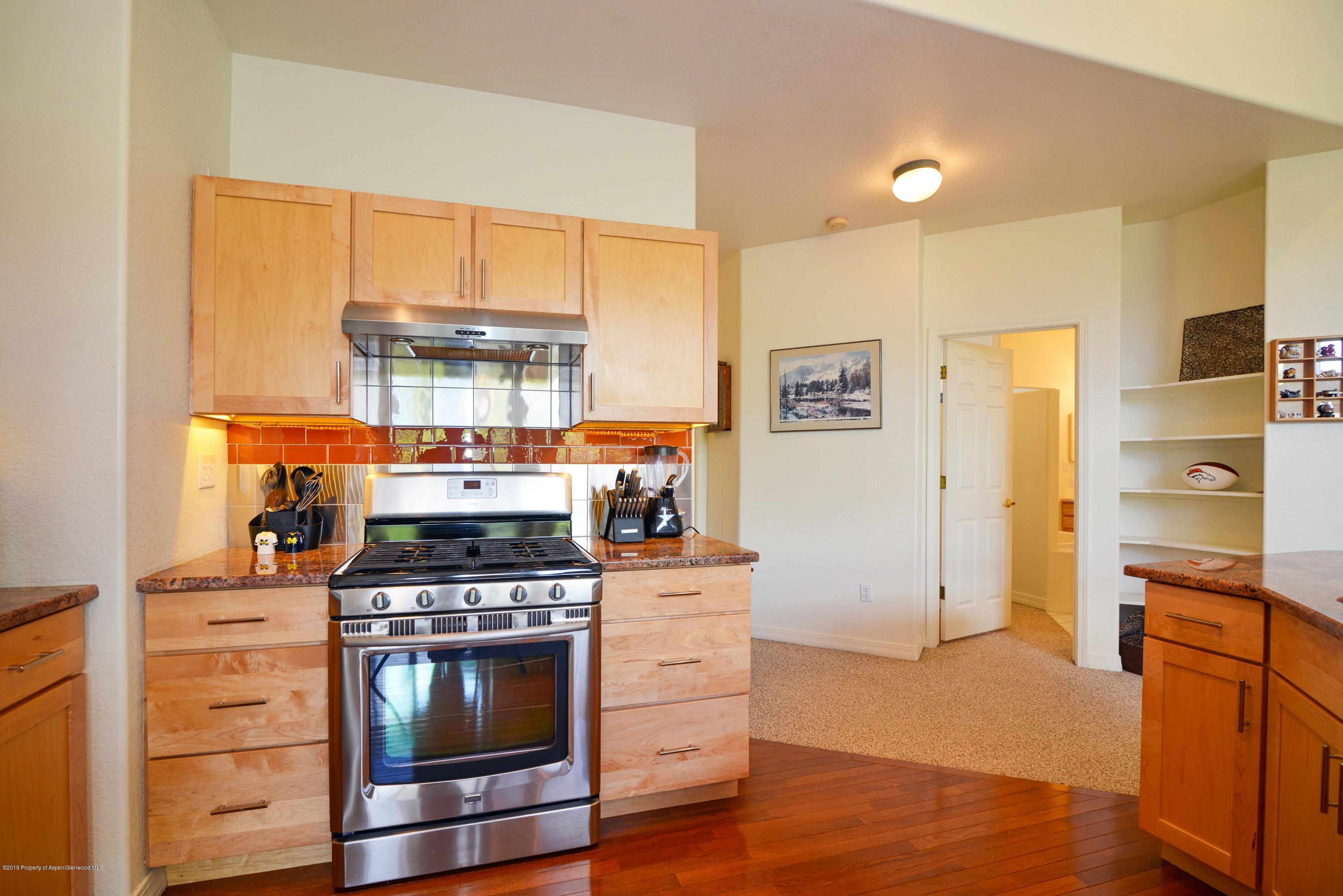 15 Pine Ridge Road Basalt, CO 81621 - Photo 5 of 17 a kitchen with stainless steel appliances a stove and a refrigerator