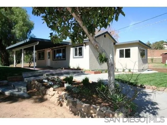 5964 Dehesa Road El Cajon, CA 92019 - Photo 5 of 13 a front view of a house with garden
