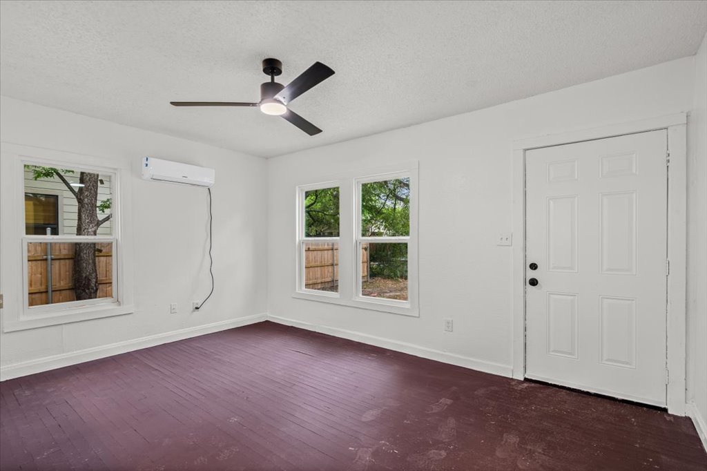 2206 Rountree Drive Austin, TX 78722 - Photo 3 of 16 a view of an empty room with a window