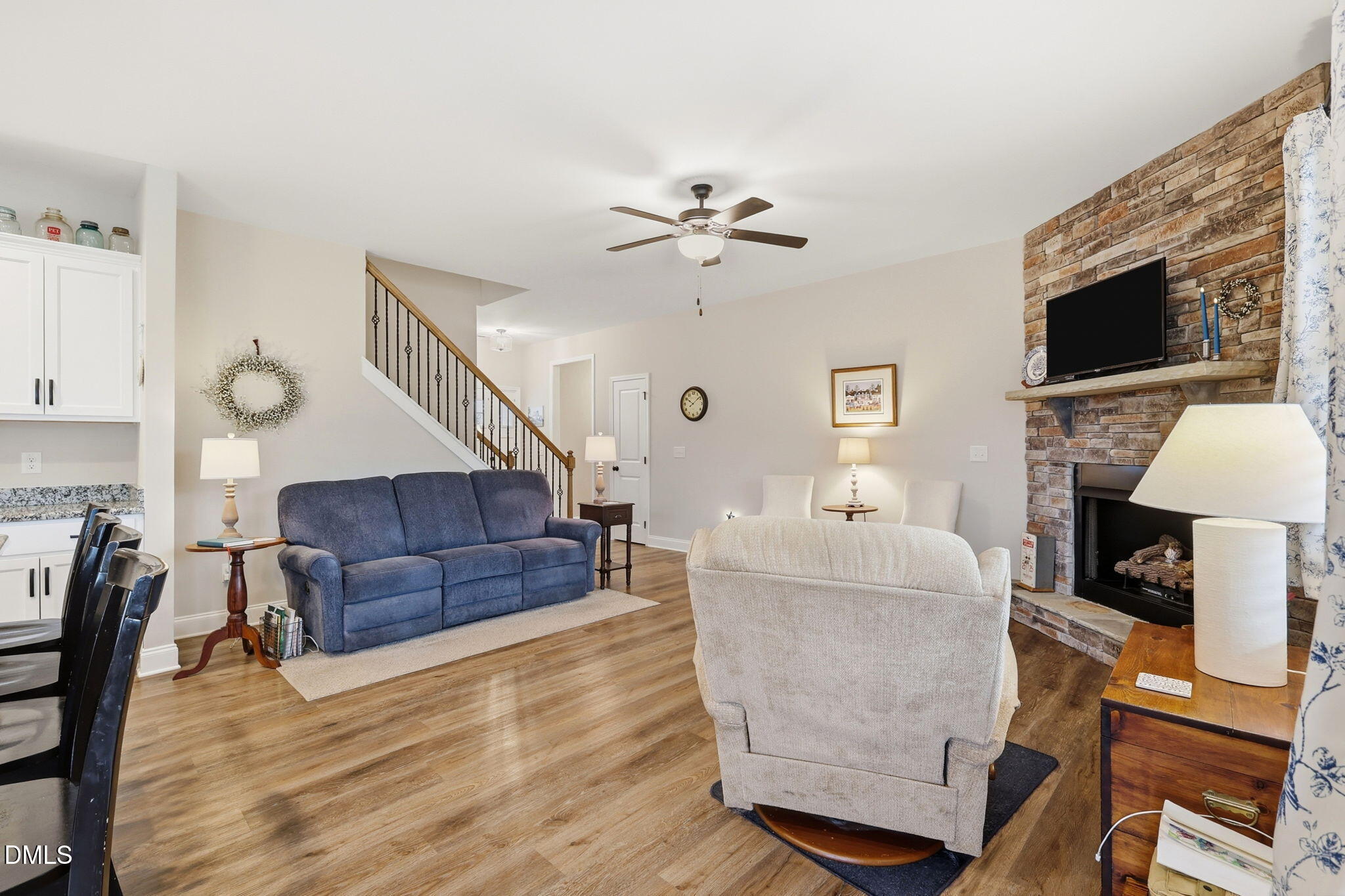 5098 Spring Hill Church Road Lillington, NC 27546 - Photo 6 of 36 a living room with furniture and a flat screen tv