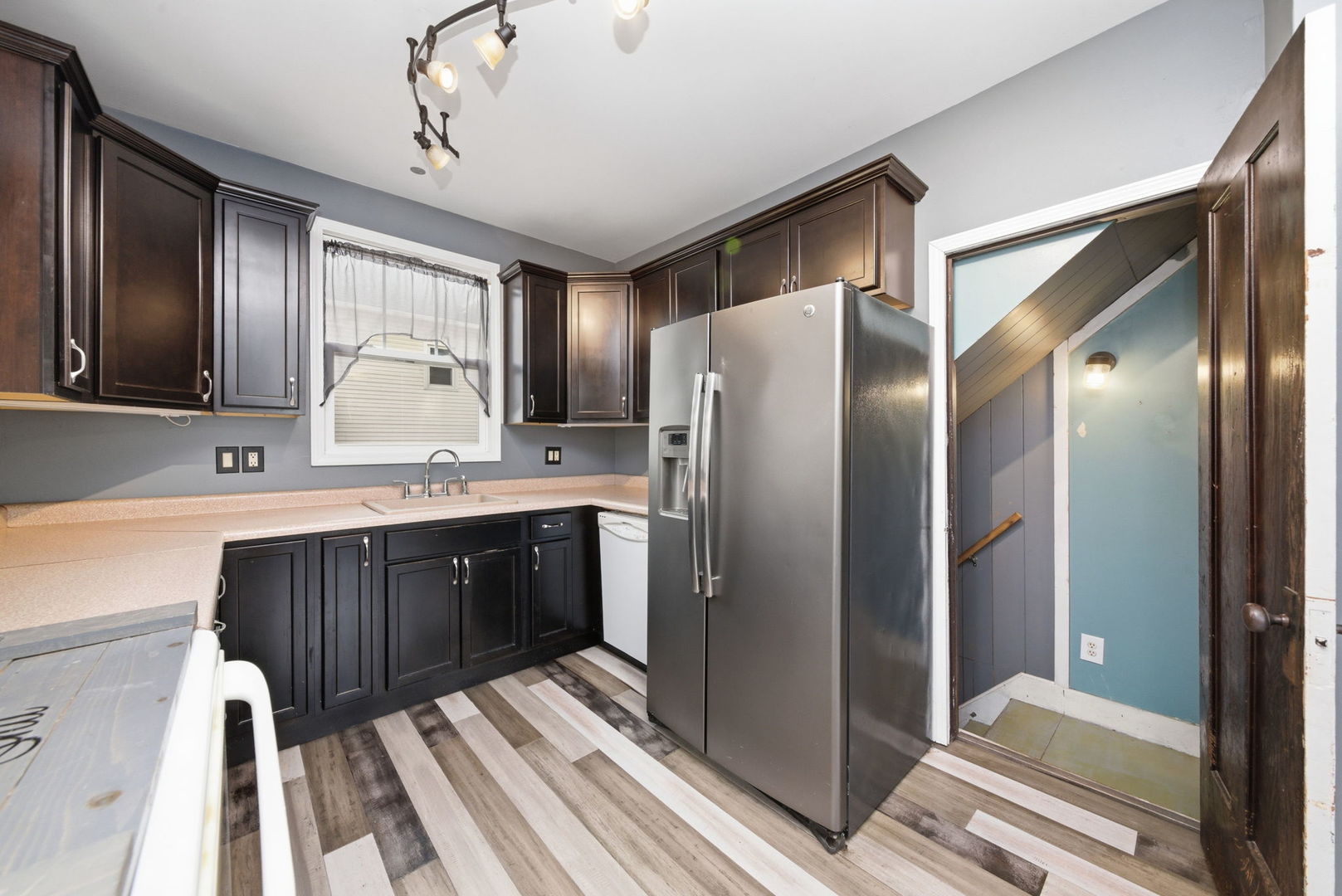500 Catherine Street Ottawa, IL 61350 - Photo 9 of 23 a kitchen with stainless steel appliances granite countertop a refrigerator a sink and wooden cabinets