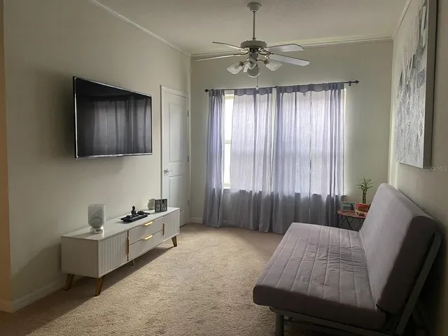 a living room with furniture and a window