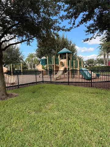 a view of a park with a large trees