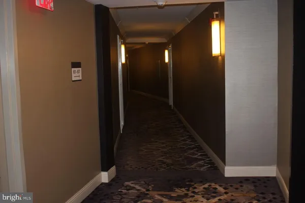 a view of a livingroom with furniture and a flat screen tv