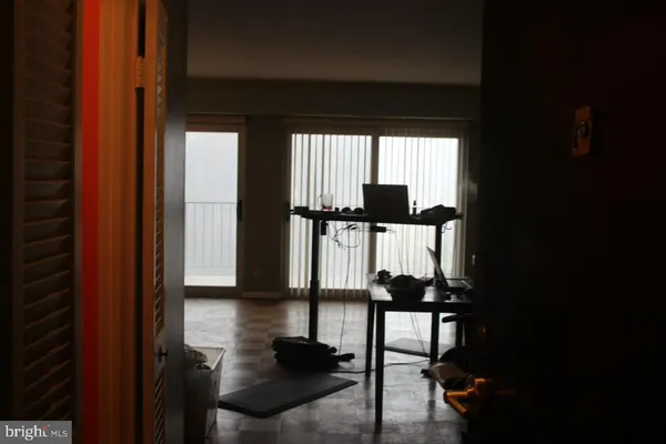 a view of a livingroom with furniture and a flat screen tv