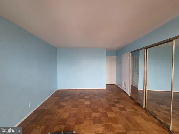 a view of a kitchen with a sink and a refrigerator