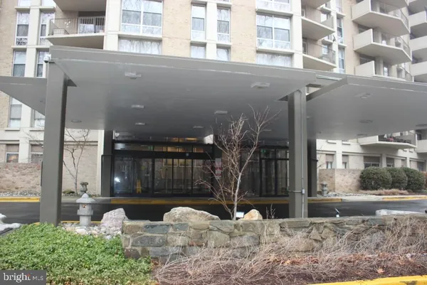 a view of a building with a yard